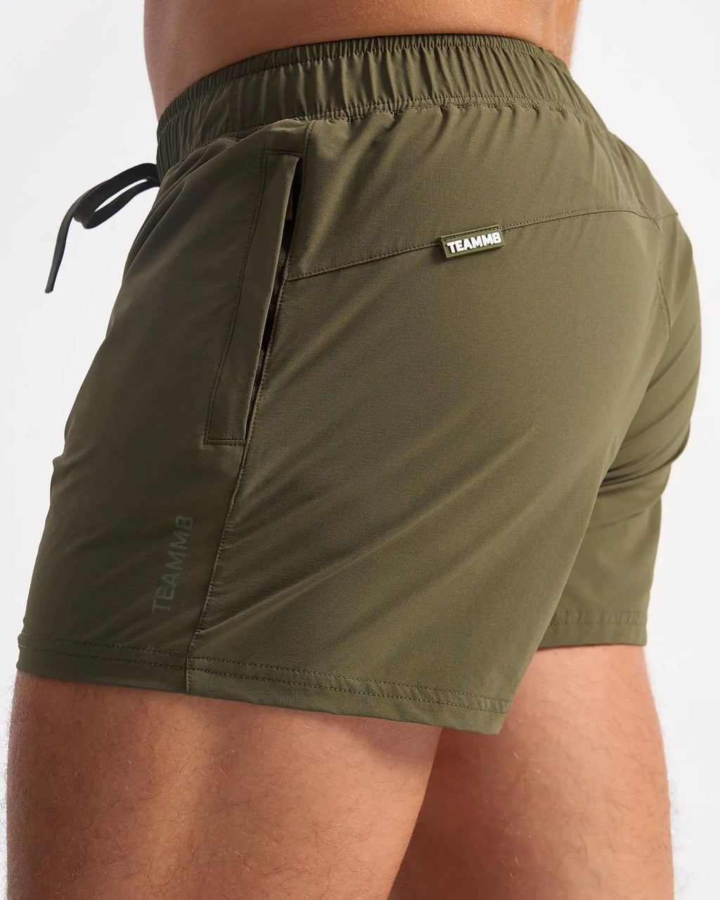 Olive green bolt 3 inch shorts with drawstring waistband and side pockets designed for athletic use