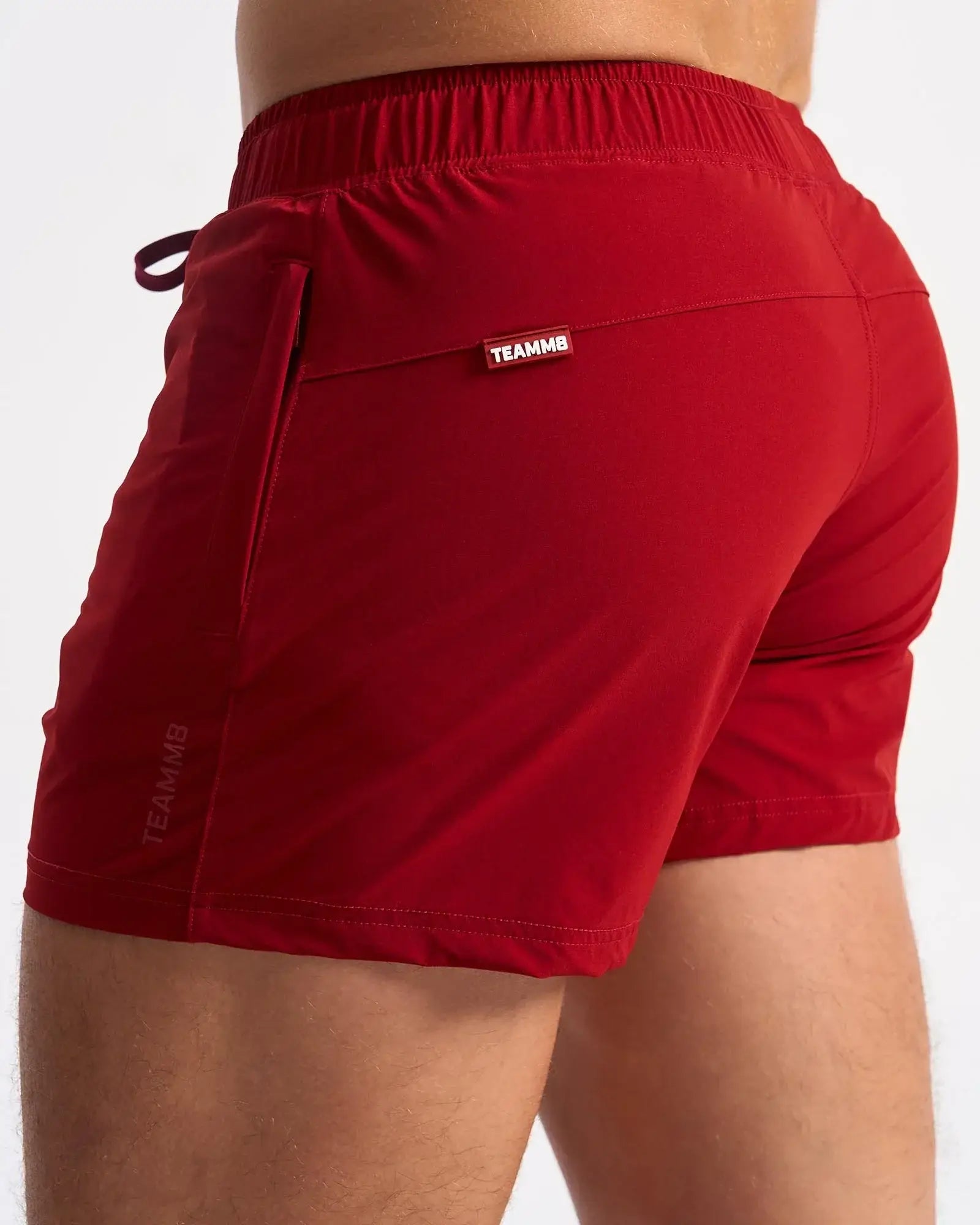 Red teammb bolt 3 short athletic shorts with elastic waistband and side pocket for active use