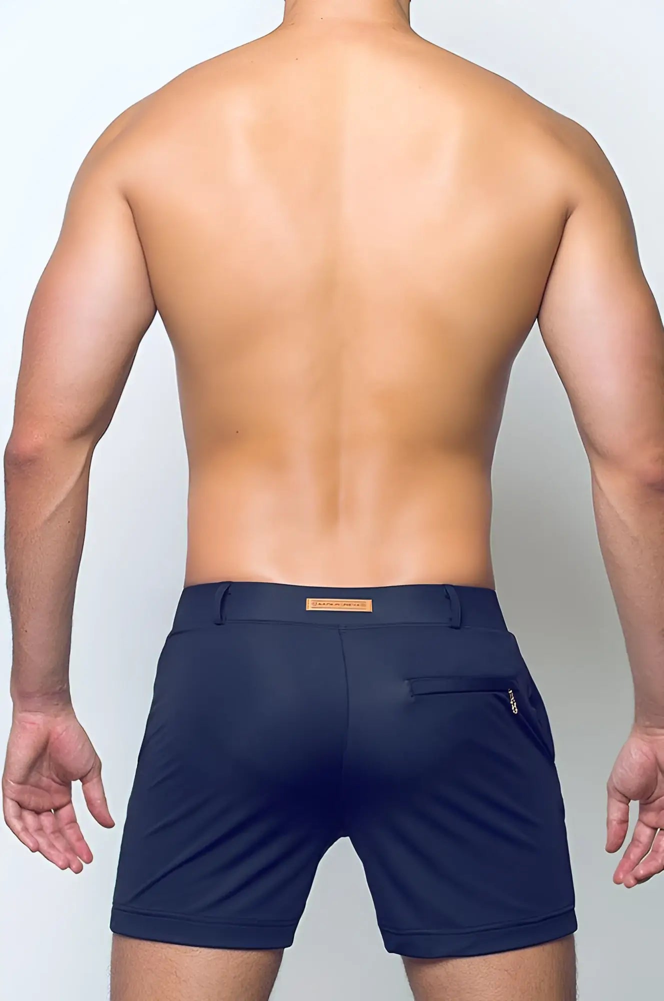 Navy blue bondi short athletic shorts with subtle textured fabric and small brown leather patch at the waistband