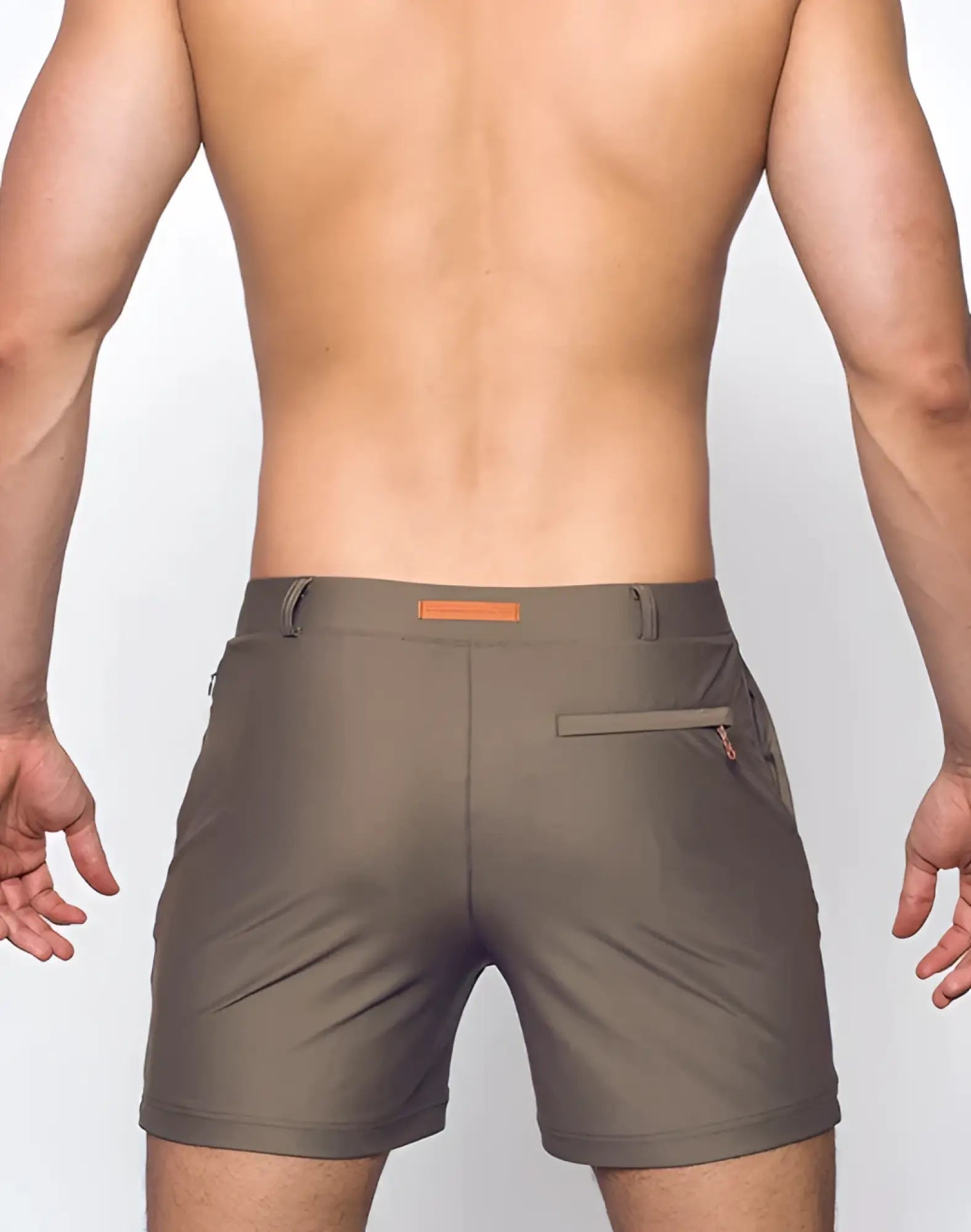 Olive green bondi short athletic shorts with subtle orange belt loop accent and zippered side pockets