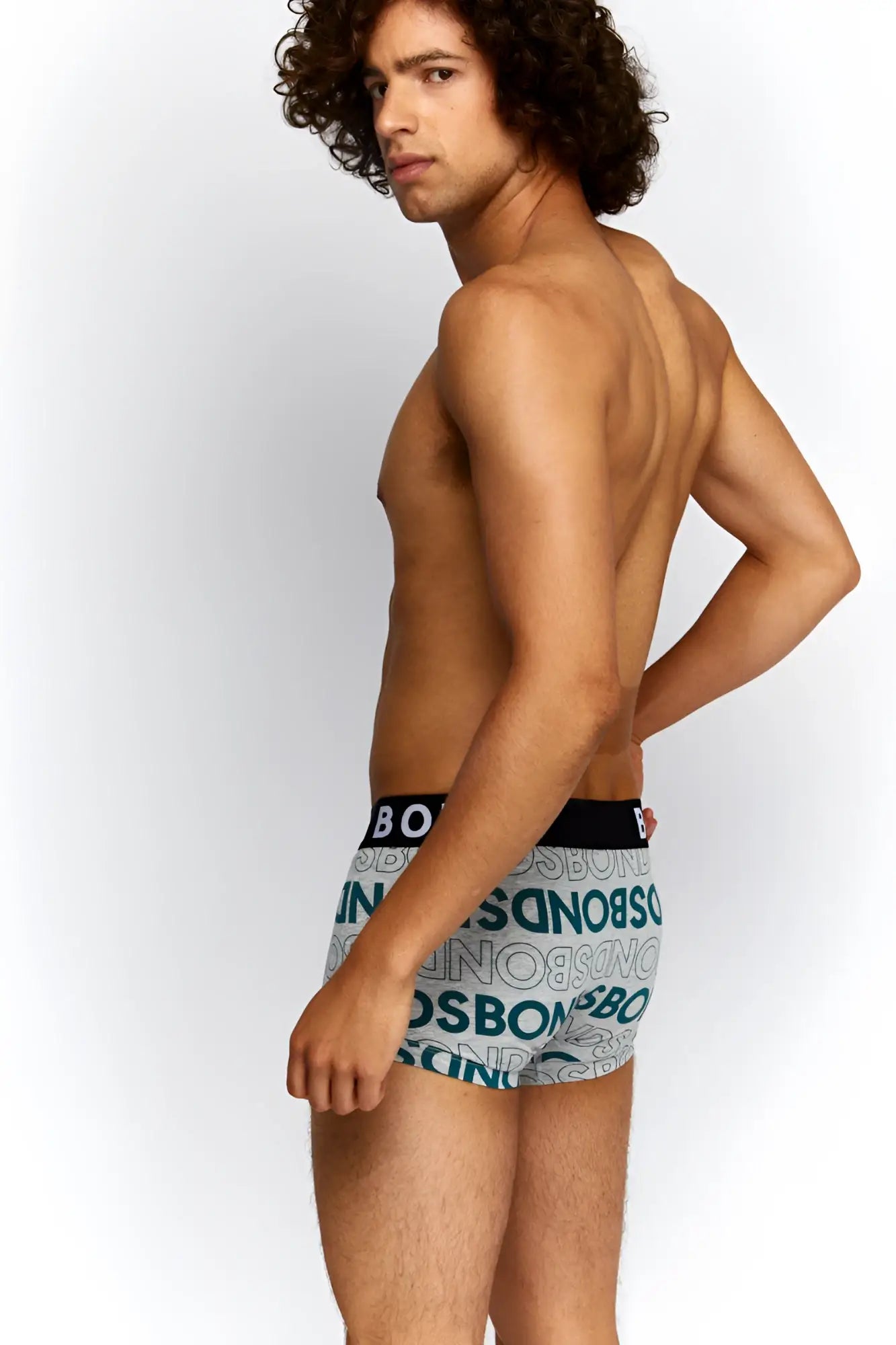 Gray boxer briefs with teal boss logo pattern and black waistband from Bonds allover logo fit trunk underwear size M
