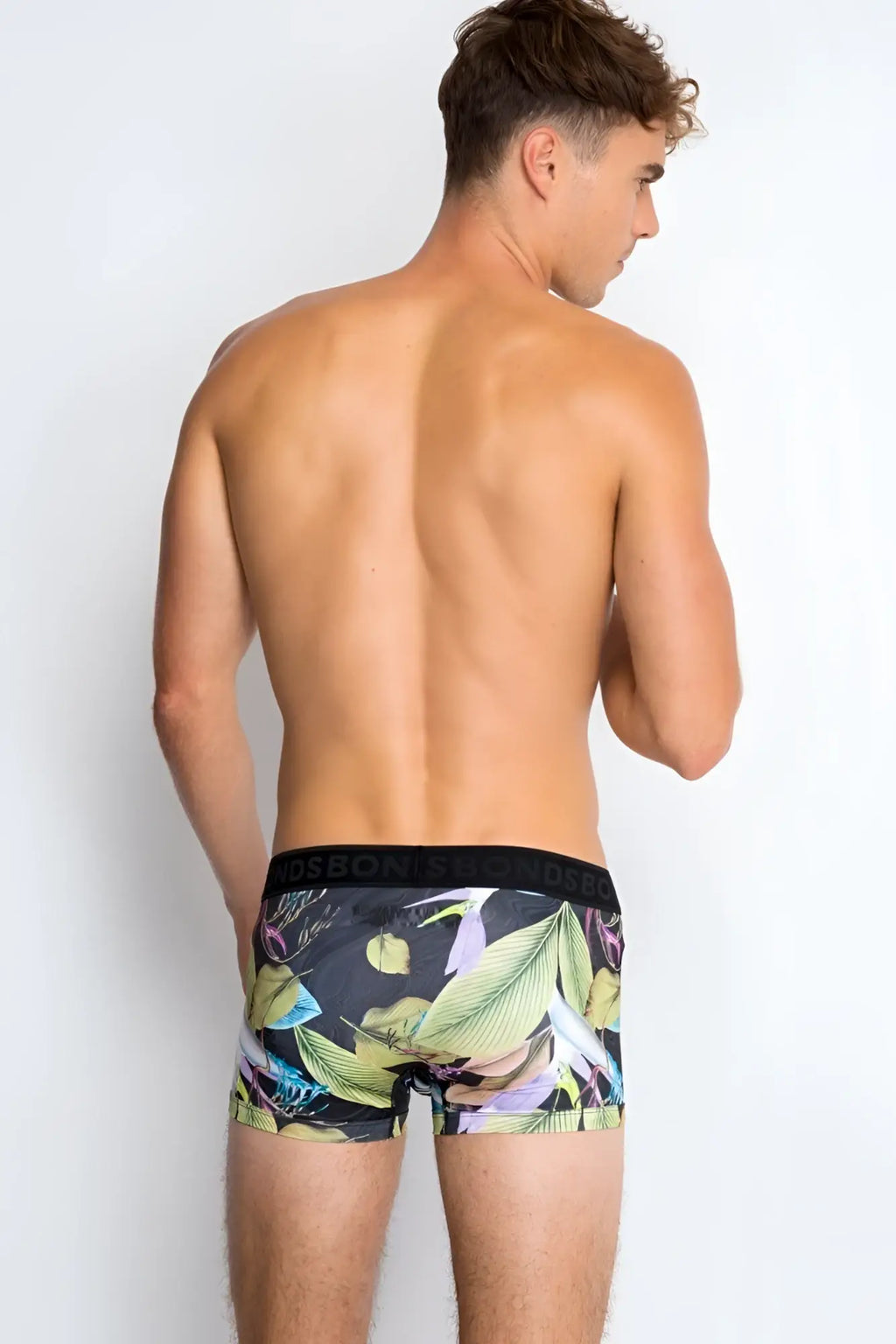 Bonds Fit Luxe trunk boxer briefs in black with vibrant tropical leaf pattern in green yellow and purple size XS