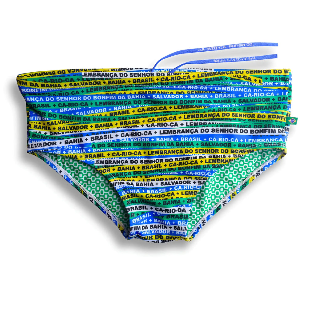 Bonfim sunga men’s designer swimwear in vibrant green and blue with bold yellow and white repeating text pattern brief cut
