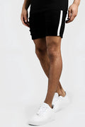 Boohoo black skinny fit distressed denim shorts with white vertical side tape in size 32