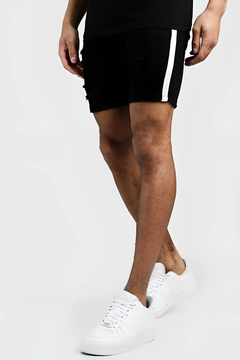 Boohoo black skinny fit distressed denim shorts with white vertical side tape in size 32
