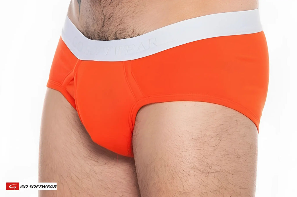 Bright orange boost padded front pouch briefs with white elastic waistband featuring go softwear brand name
