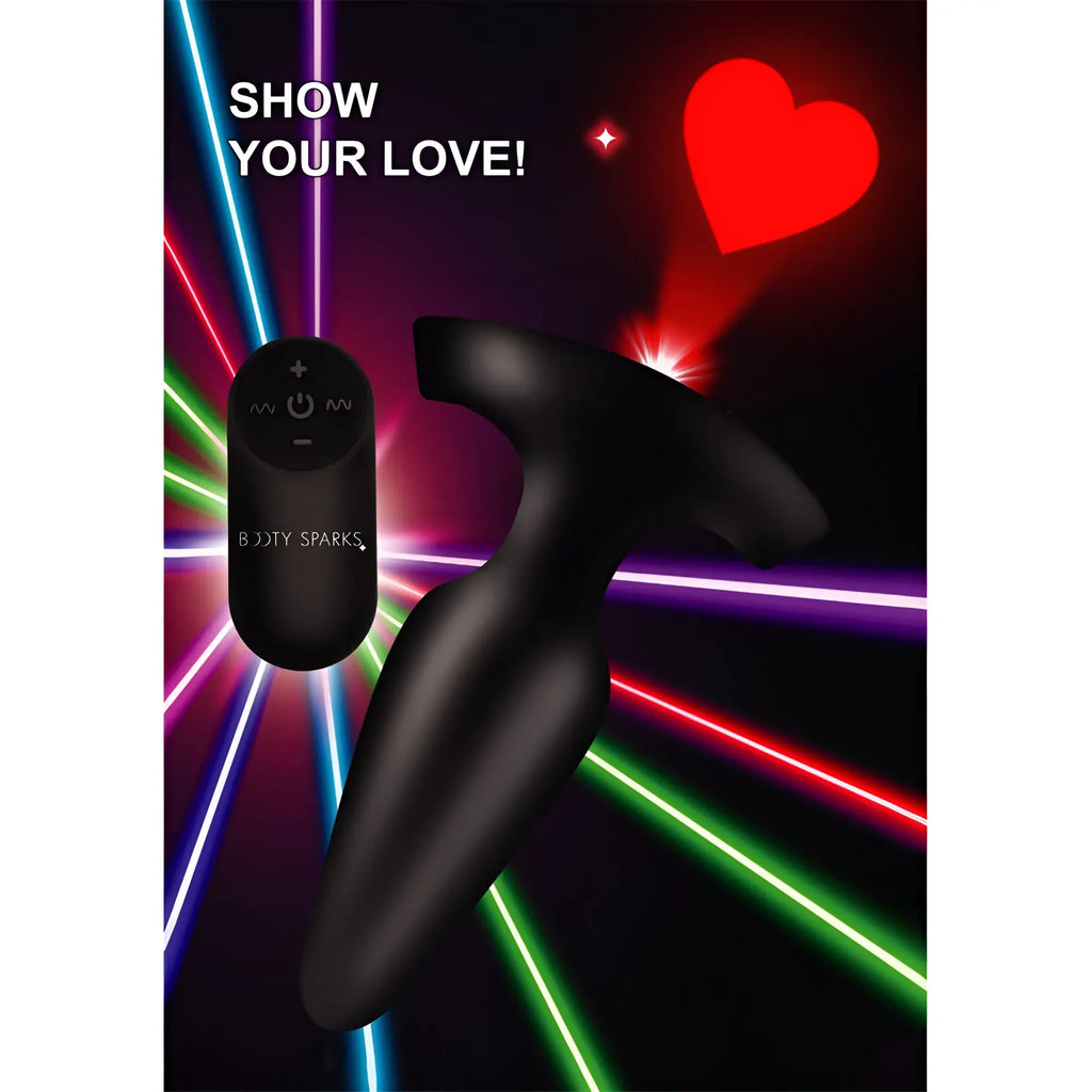 Booty Sparks 28X black silicone anal plug with remote control, projecting a red heart light against a laser background.