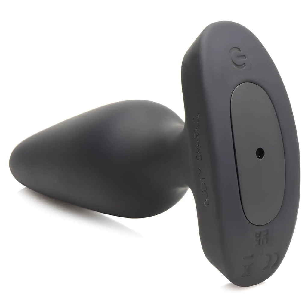Booty Sparks 28X black silicone anal plug with a heart-shaped base and power button, isolated on a white background.