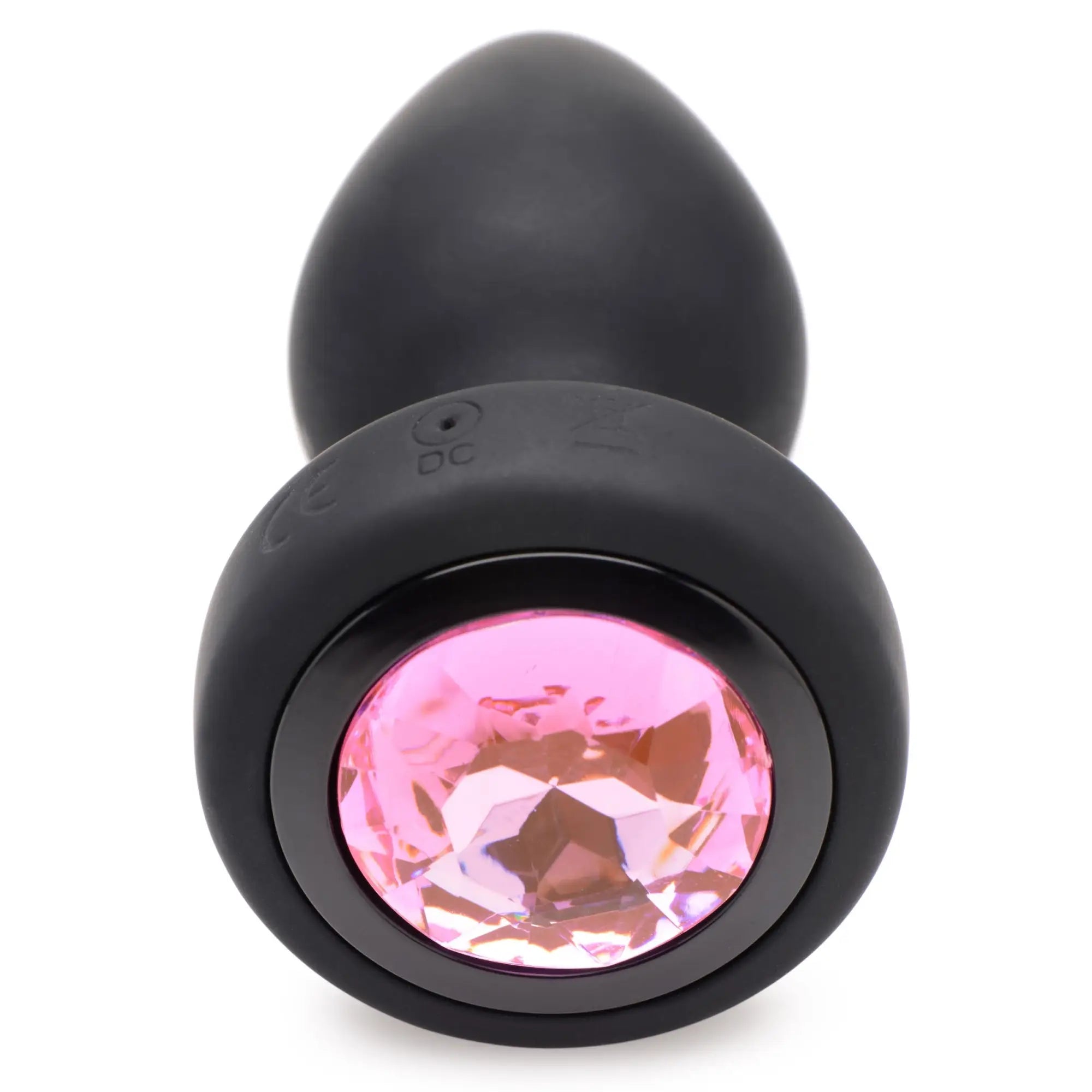 Booty Sparks 28X vibrating black silicone anal plug featuring a round, faceted pink gem base.