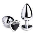 Booty Sparks Black Heart Gem Anal Plug: Two shiny, silver-toned metal plugs featuring a faceted black heart-shaped base.