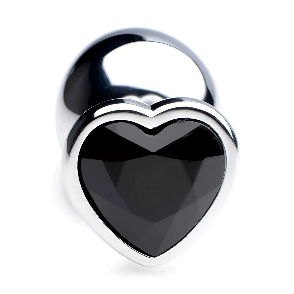 Booty Sparks black heart gem anal plug featuring a polished silver base and a faceted black heart-shaped jewel.