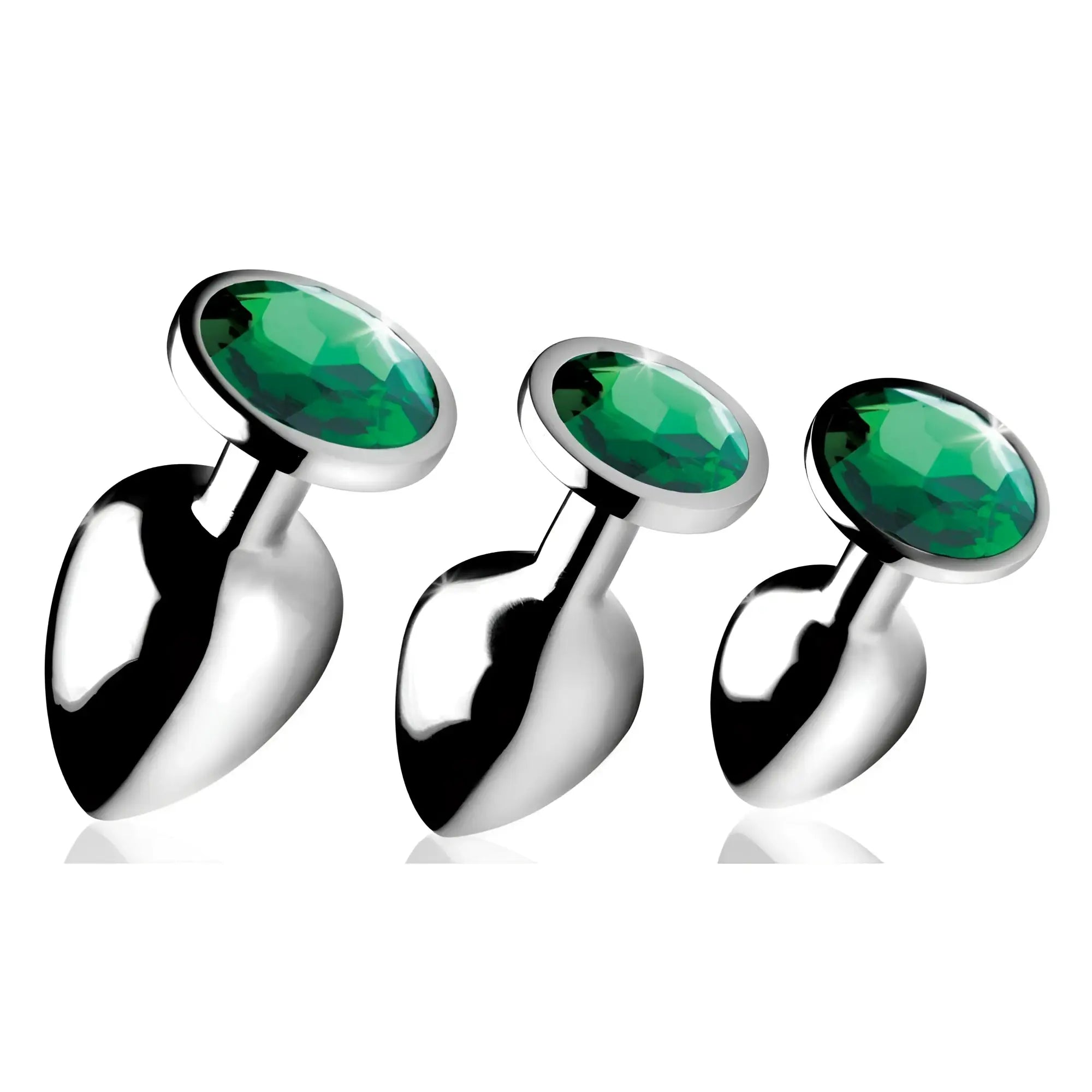 Booty Sparks Emerald Gem anal plug set: three silver metal plugs featuring faceted, round emerald-green crystals.