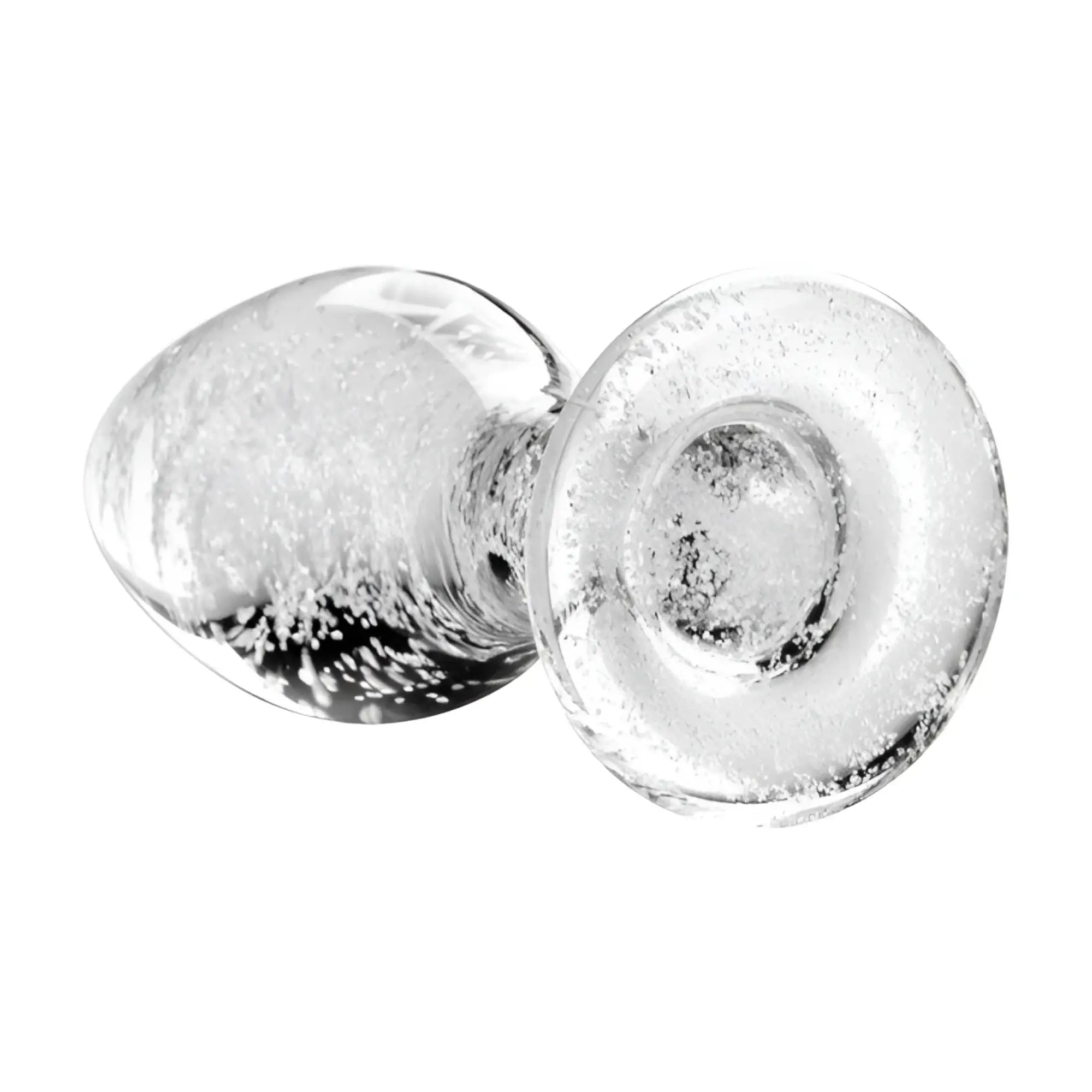 Booty Sparks glow-in-the-dark glass anal plug featuring a clear, bubble-filled textured design on a white background.