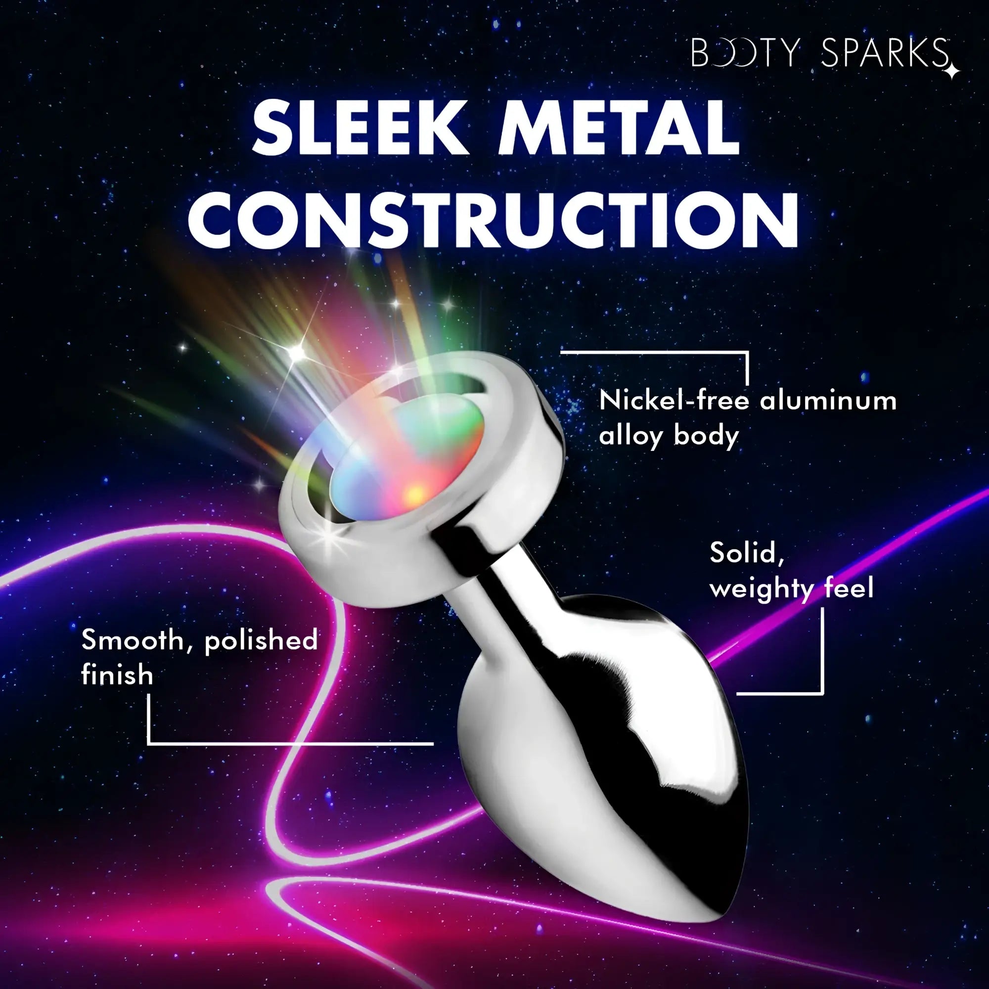 Booty Sparks light-up anal plug with a polished silver, nickel-free aluminum body emitting rainbow light on a galaxy BG.