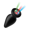 Black silicone Booty Sparks anal plug featuring a glowing LED center with colorful green, red, and blue light beams.