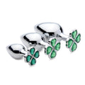 Three silver Booty Sparks Lucky Clover gem anal plugs of varying sizes, each featuring a green four-leaf clover jewel.