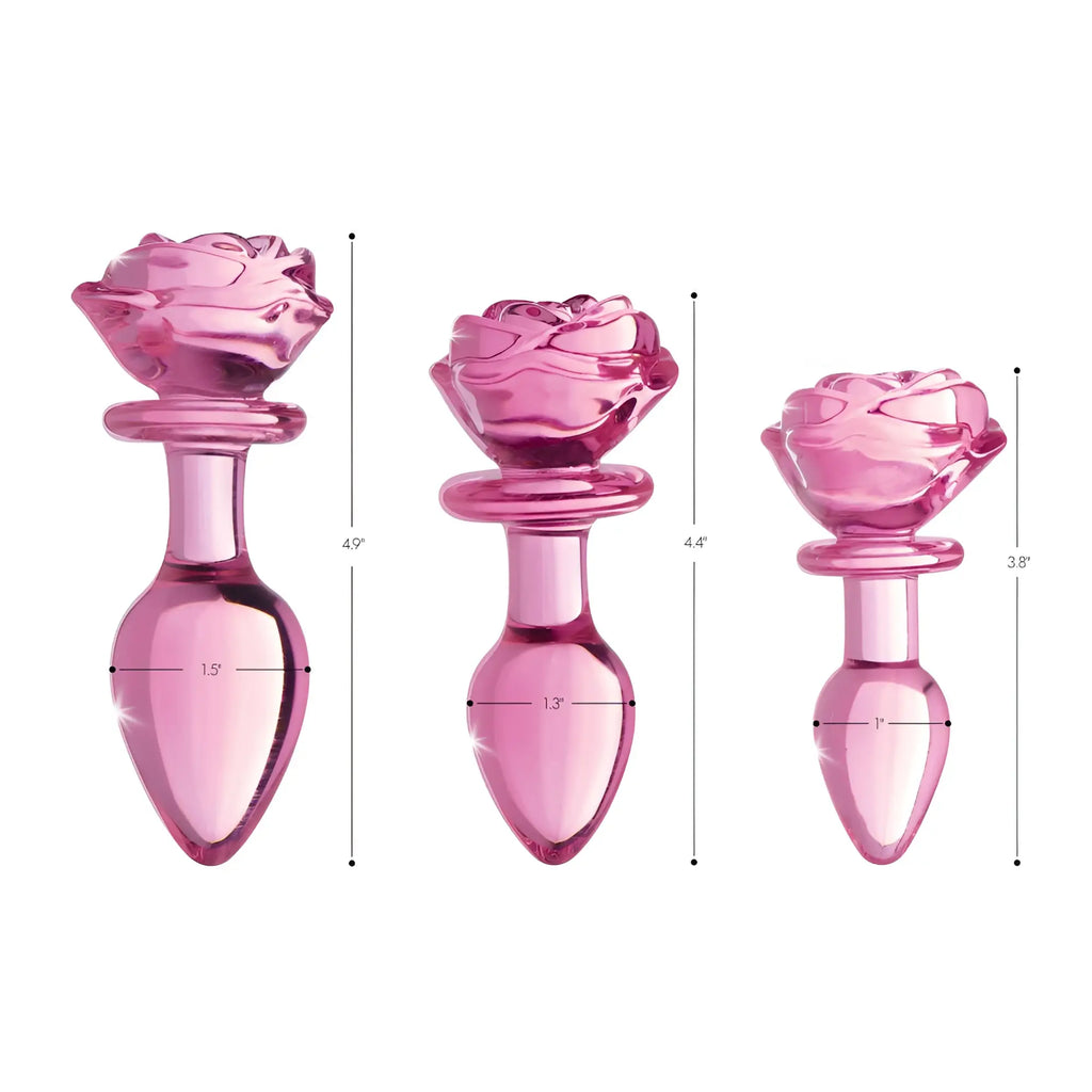 Three Booty Sparks Pink Rose glass anal plugs of varying sizes with dimension labels against a white background.