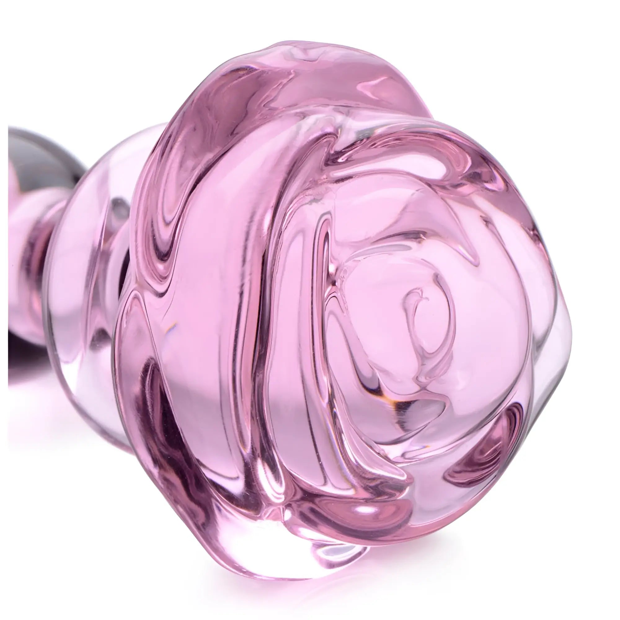 Booty Sparks Pink Rose Glass Anal Plug: A translucent light pink glass anal plug with a rose-shaped base.