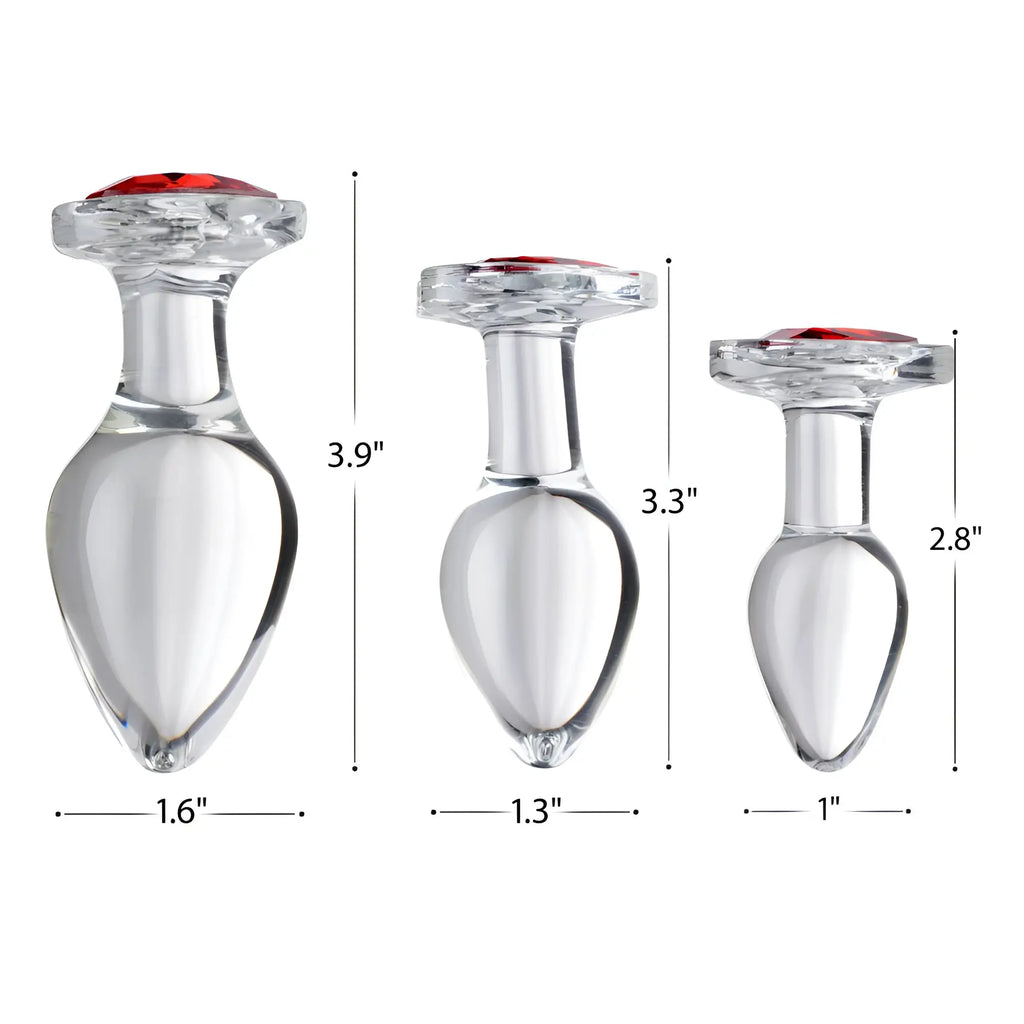 Booty Sparks Red Heart Gem Glass Anal Plug set showing three clear glass plugs with red heart tops and size labels.