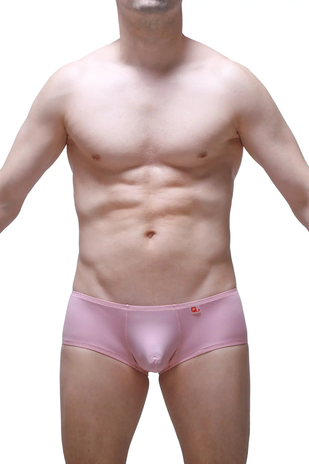 Pink men’s boxer briefs in tea rose with a small red logo on the waistband made from soft breathable fabric