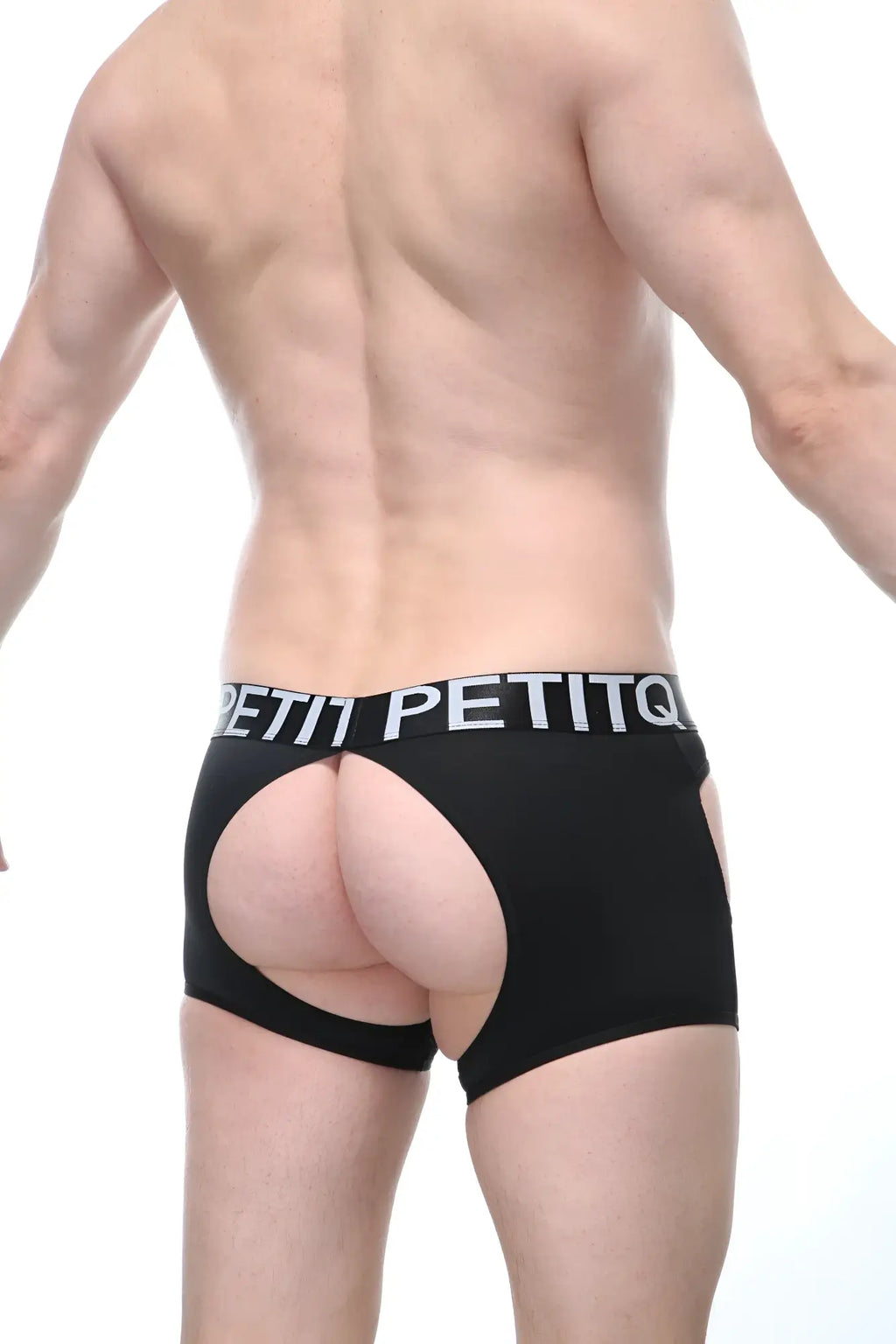 Black petitq boxer veyar briefs with a cutout design and white lettering on the waistband visible from the front side