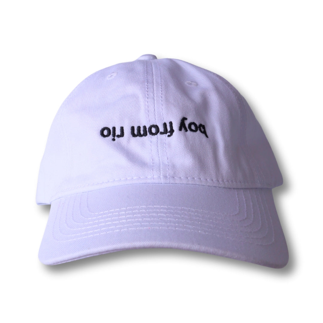 White dad hat with black embroidered boy from rio text made of soft cotton for casual outdoor wear