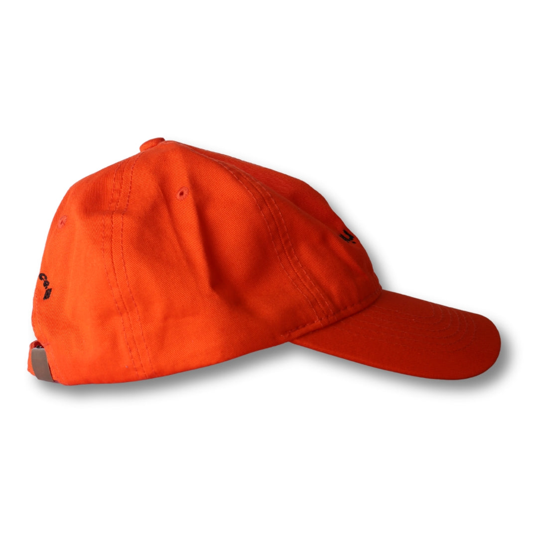 Bright orange boy from rio flip dad hat with curved brim and subtle black embroidered logo on the side