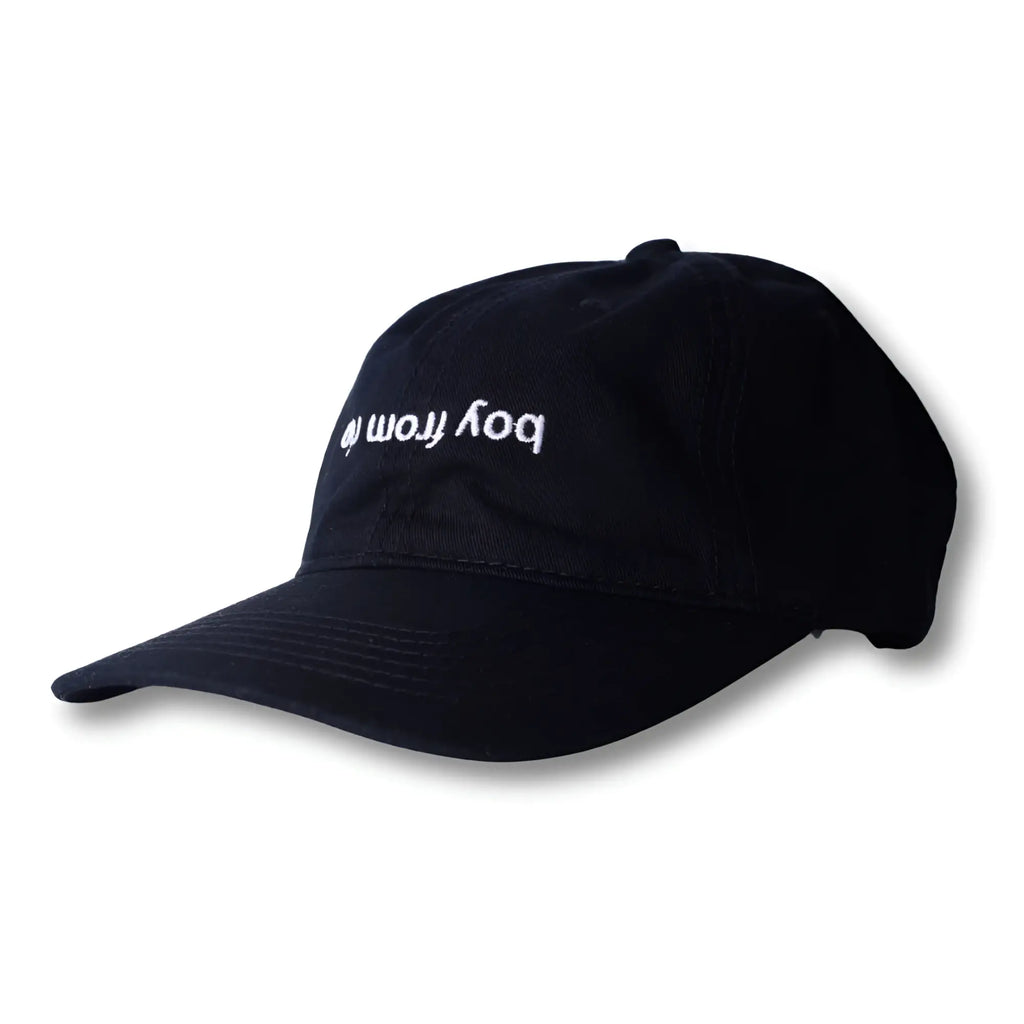 Black dad hat with white embroidered boy from text featuring a flip design from boy from rio collection