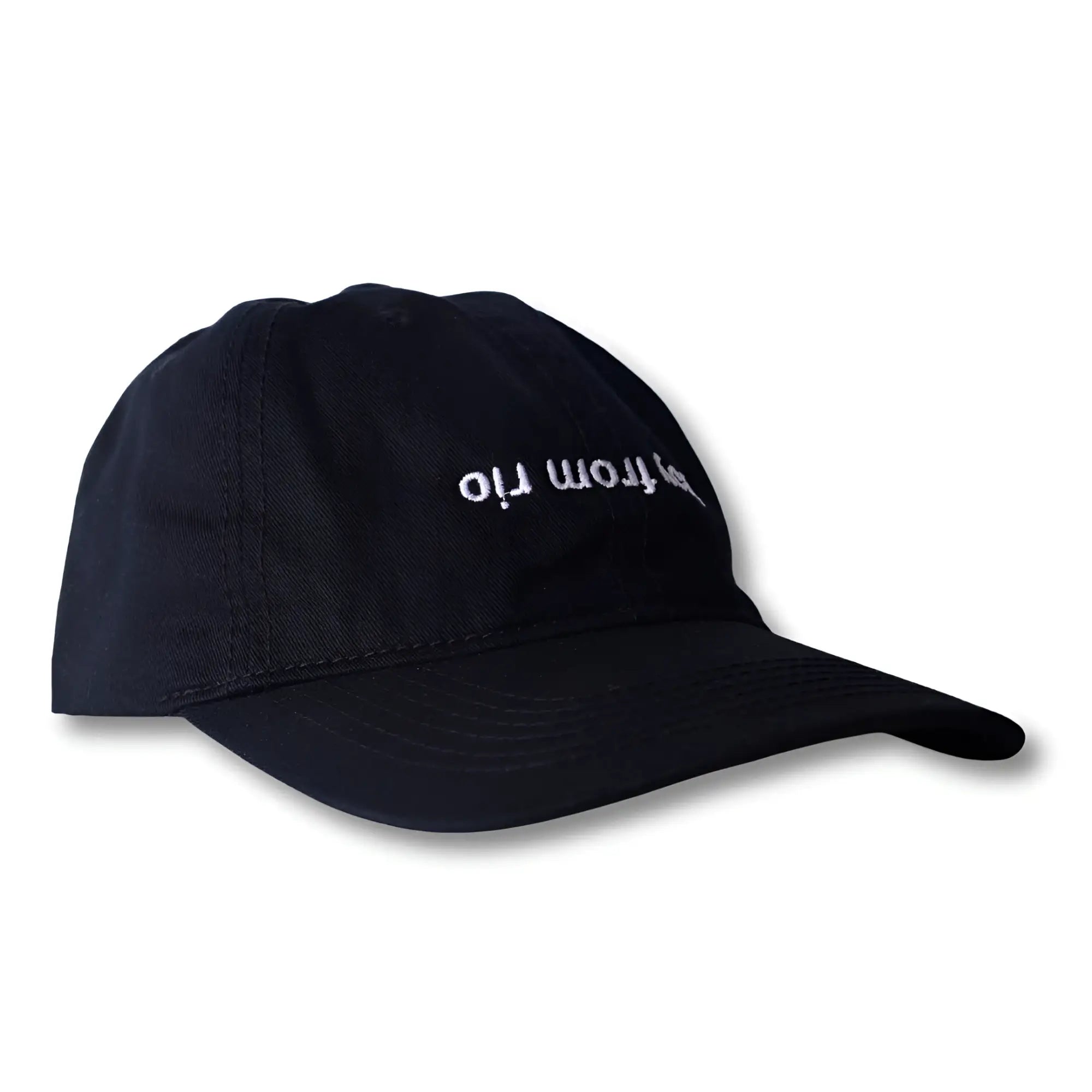 Black dad hat with white embroidered from rio text across front in boy from rio flip design