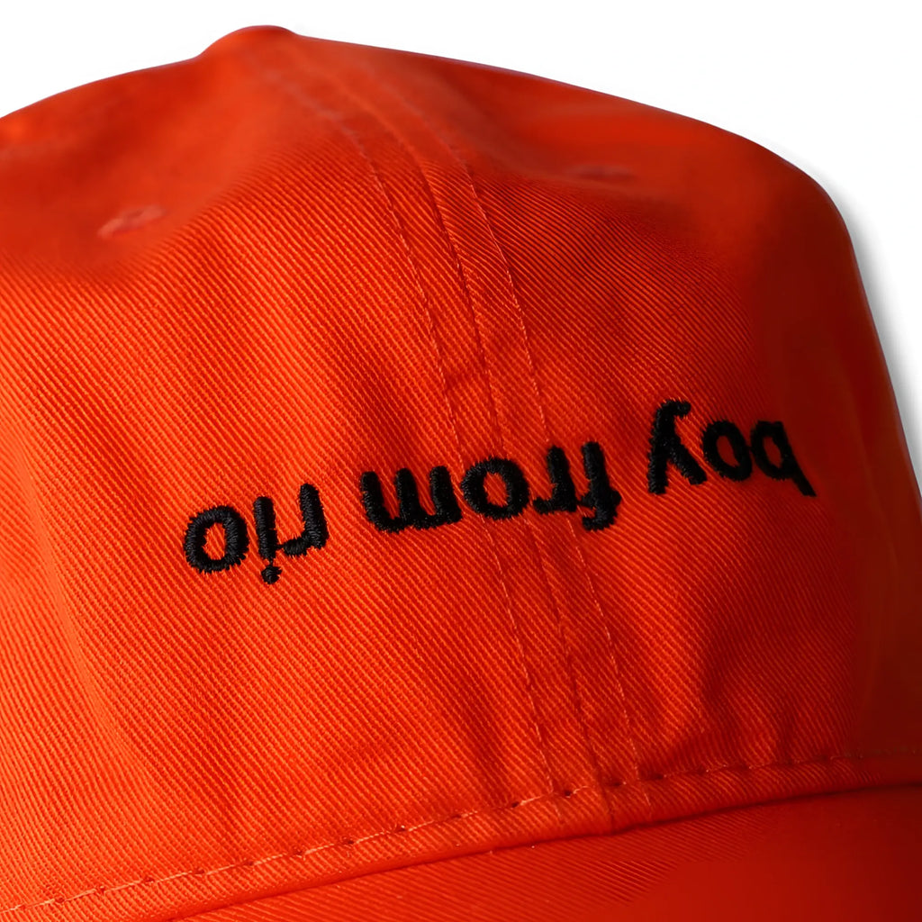 Bright orange dad hat with black embroidered boy from iri text perfect for casual outdoor wear