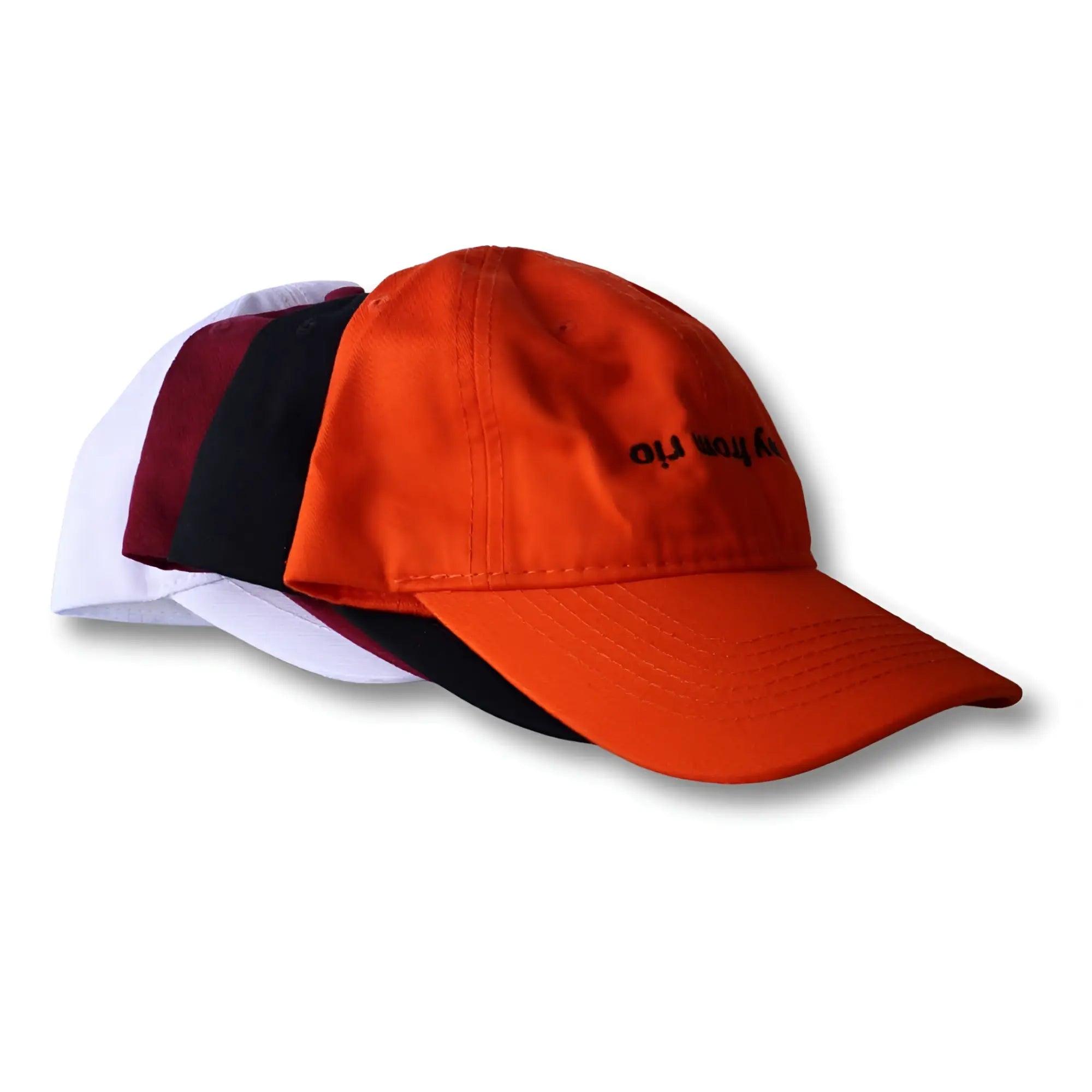 Bright orange dad hat with black embroidered text on front from boy from rio flip collection
