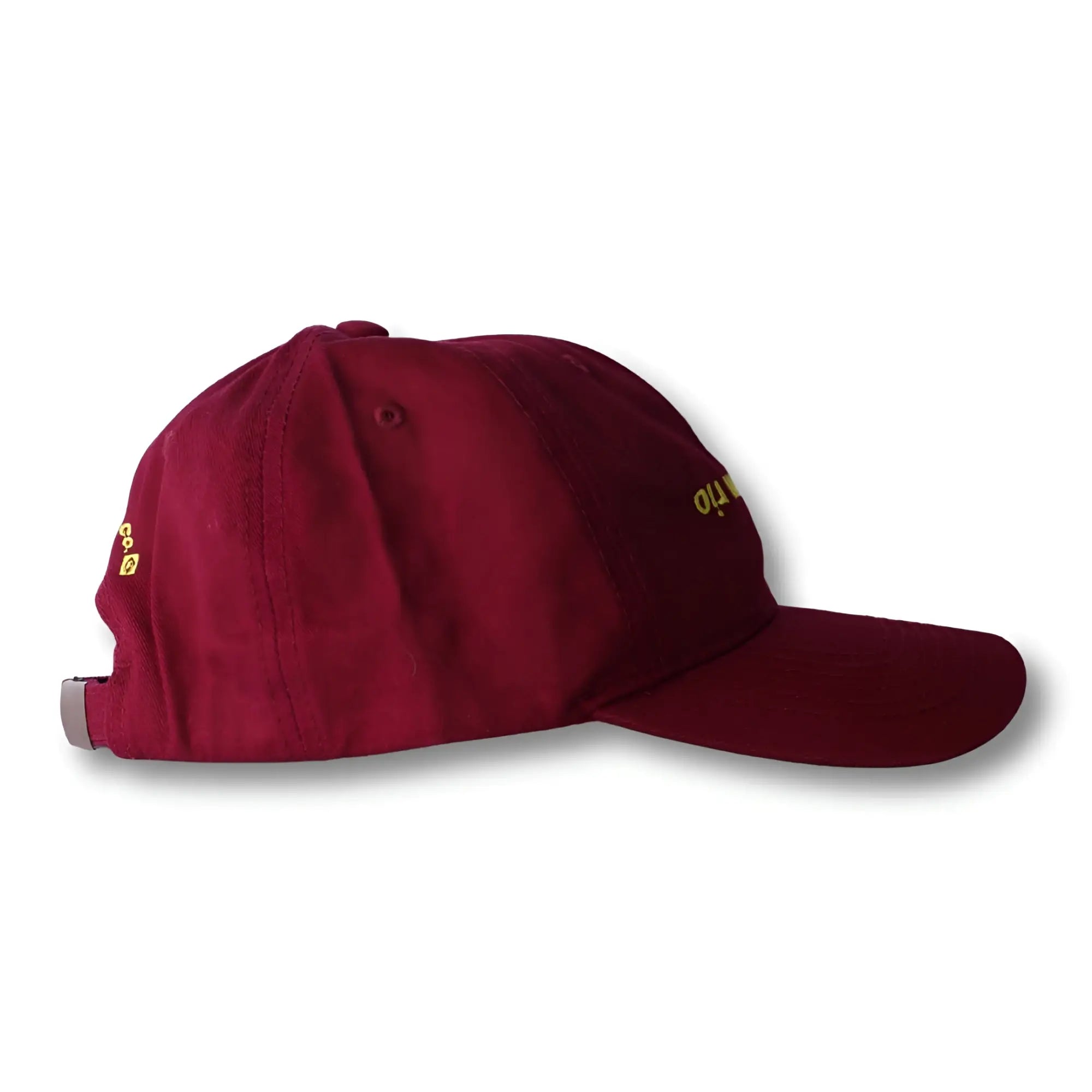 Maroon dad hat boy from rio flip with gold embroidered text on the side and silver adjustable strap on the back