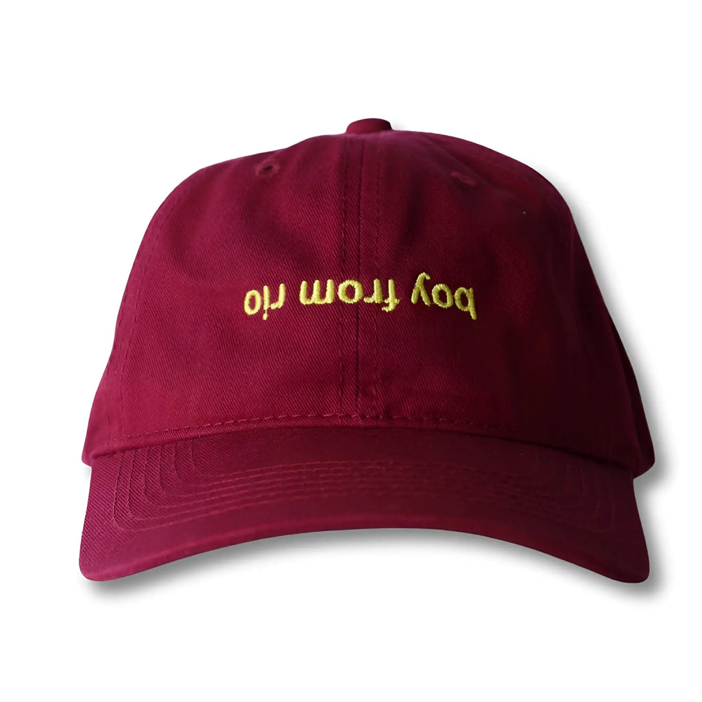 Maroon dad hat with gold embroidered text bod from iri from the boy from rio flip collection