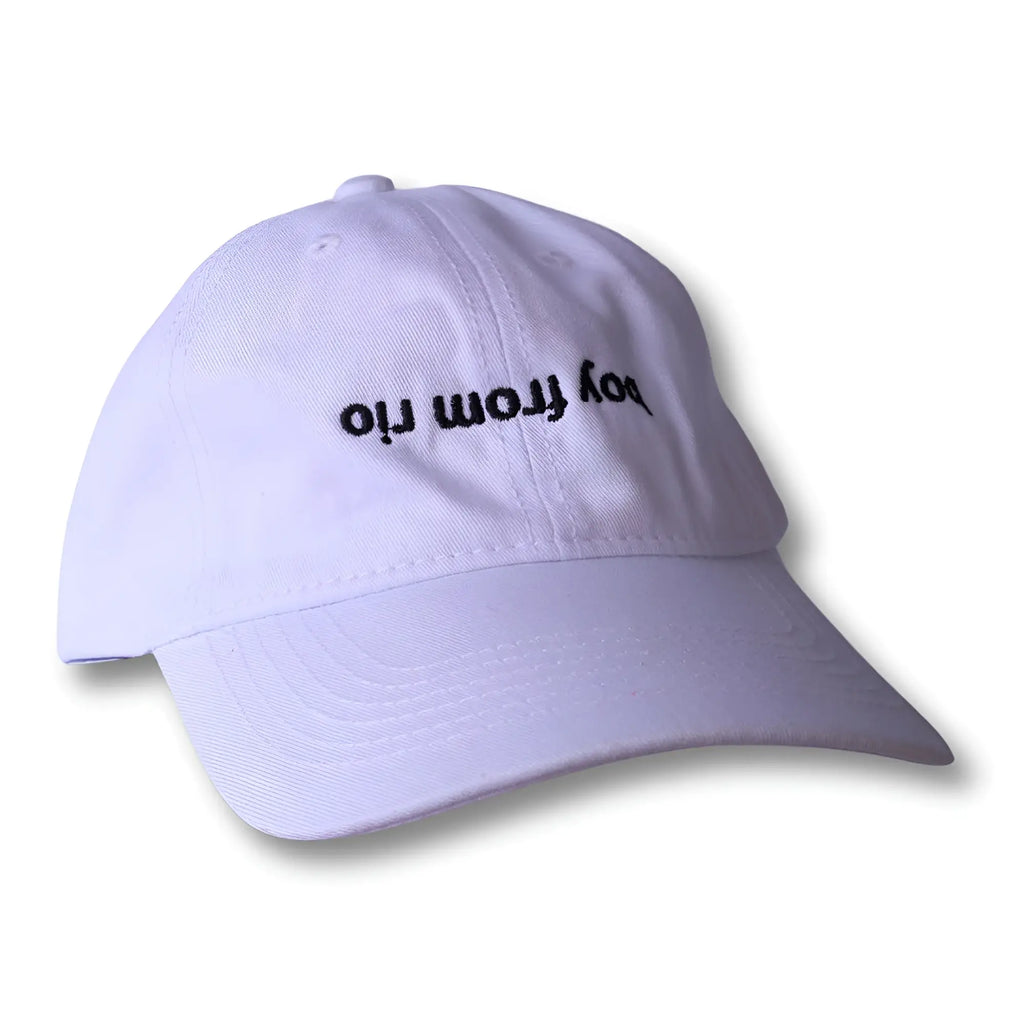 White dad hat with black embroidered boy from rio text casual baseball cap for everyday wear