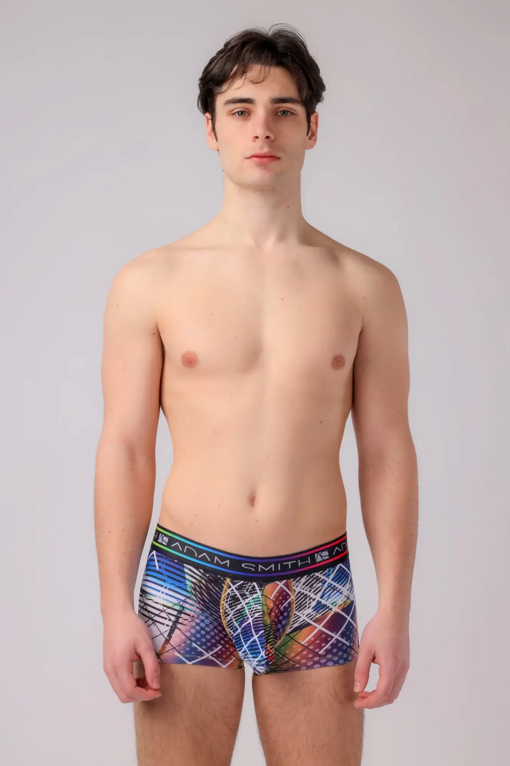 Adam Smith men’s boyshort boxer briefs with vibrant abstract geometric pattern in blues reds purples and colorful waistband