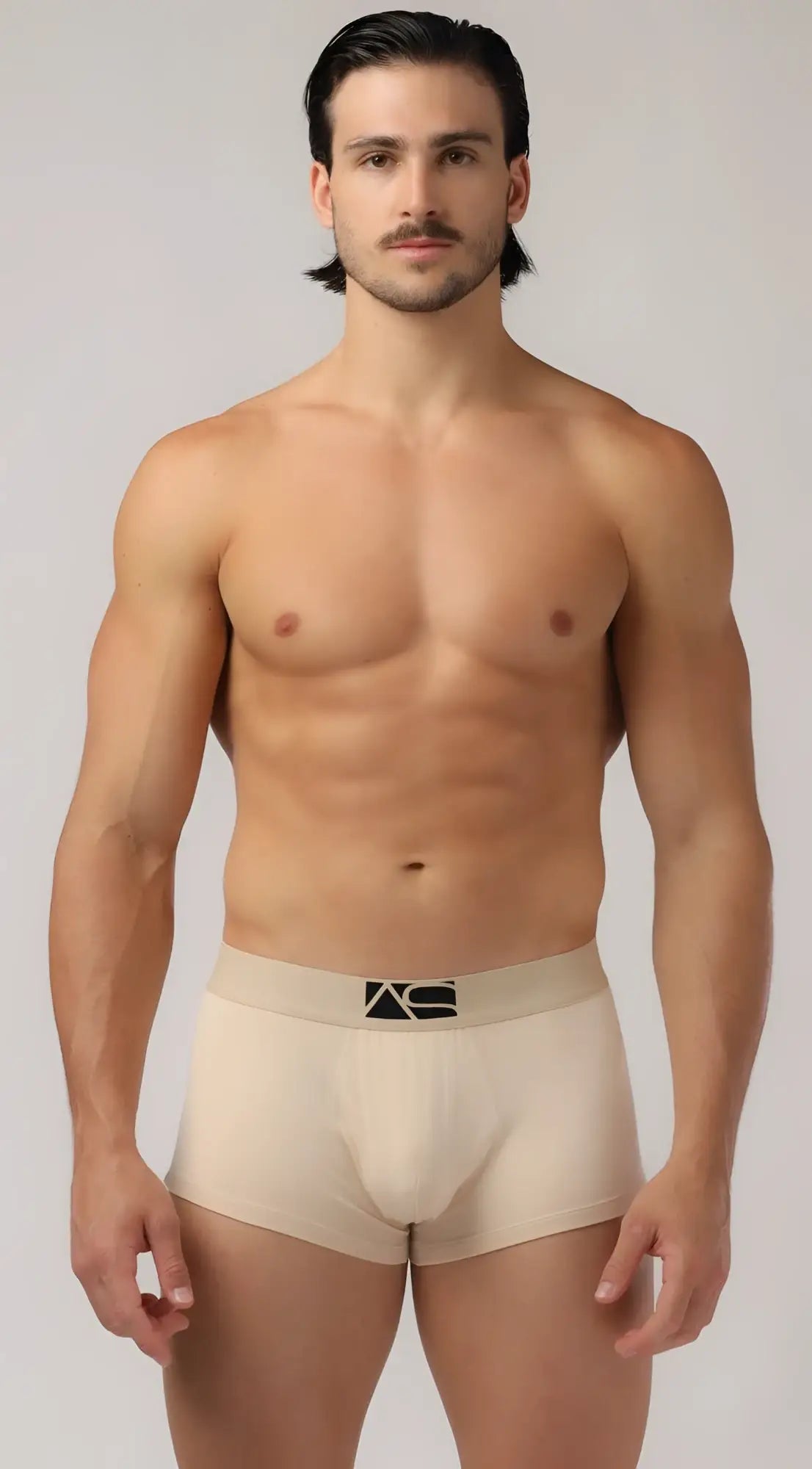 Beige men’s boyshorts briefs with black logo on waistband made from soft breathable fabric for everyday comfort