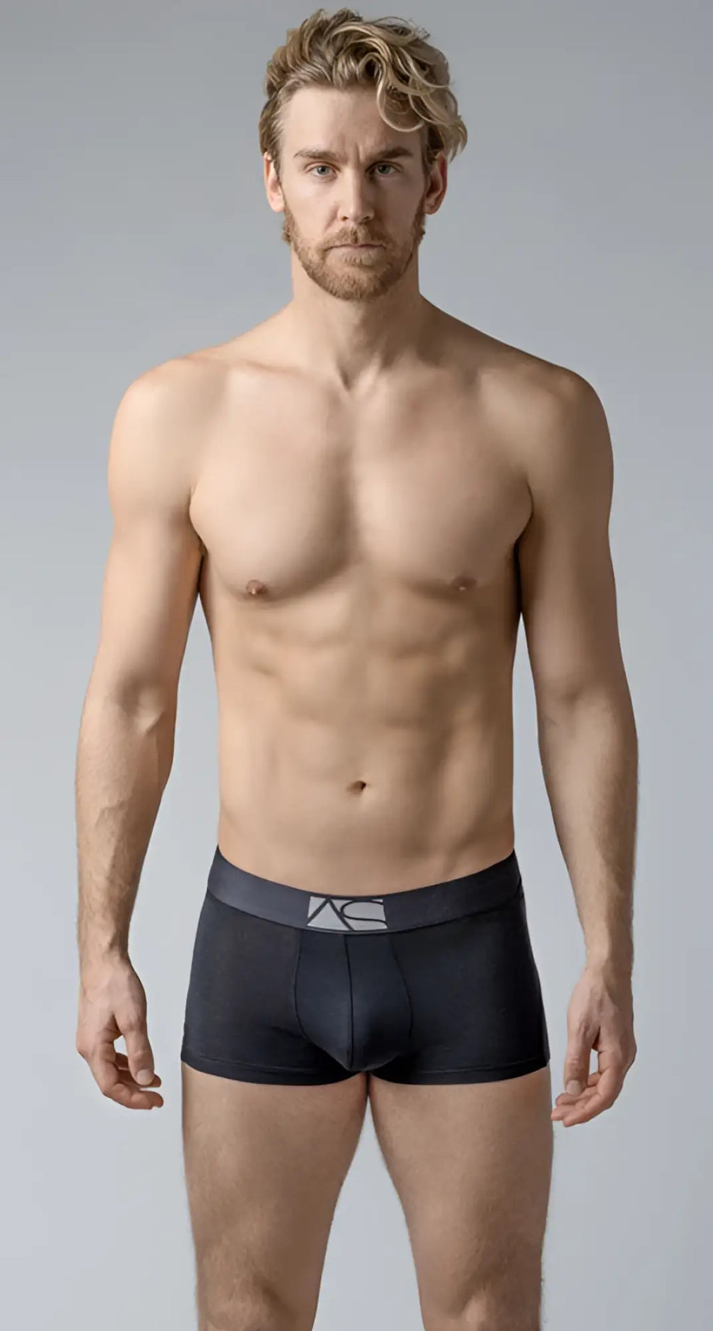 Black men’s briefs with a dark gray waistband featuring the ac logo in boyshorts style