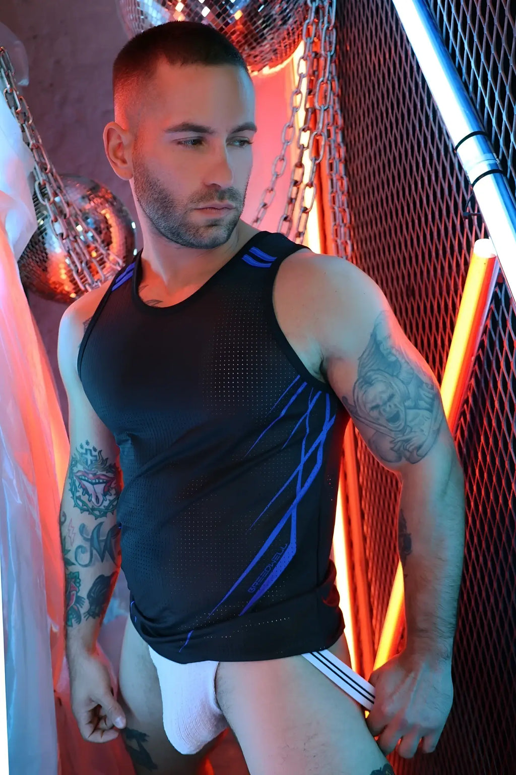 Black athletic tank top revolution tank with blue diagonal stripe accents designed for active wear