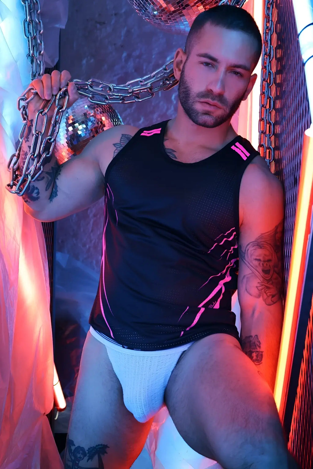 Black Revolution Tank athletic tank top with neon pink lightning bolt design and breathable mesh panels