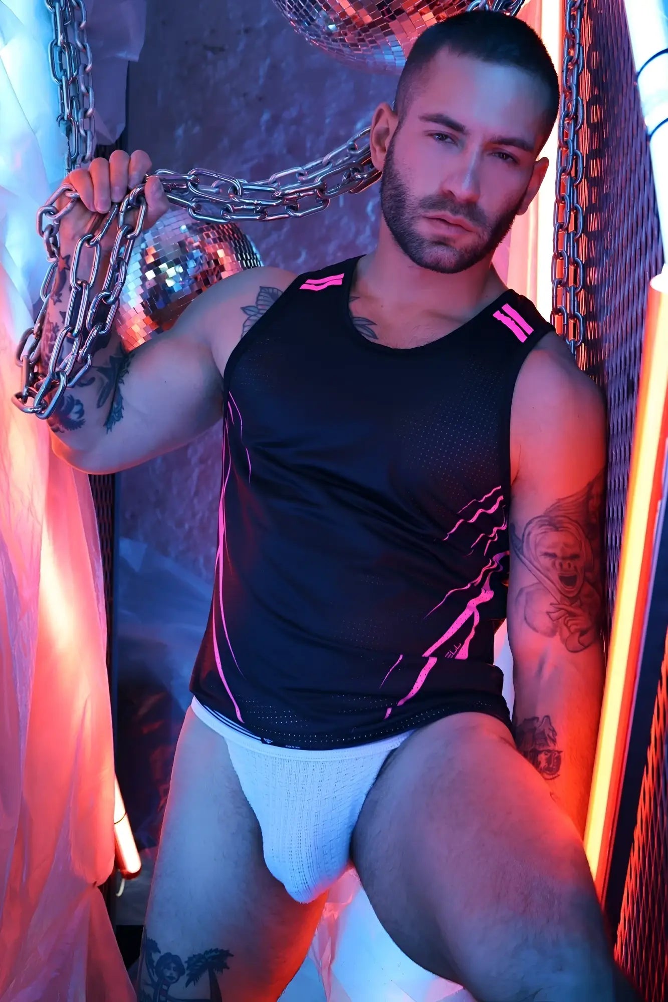Black Revolution Tank athletic tank top with neon pink lightning bolt design and breathable mesh panels