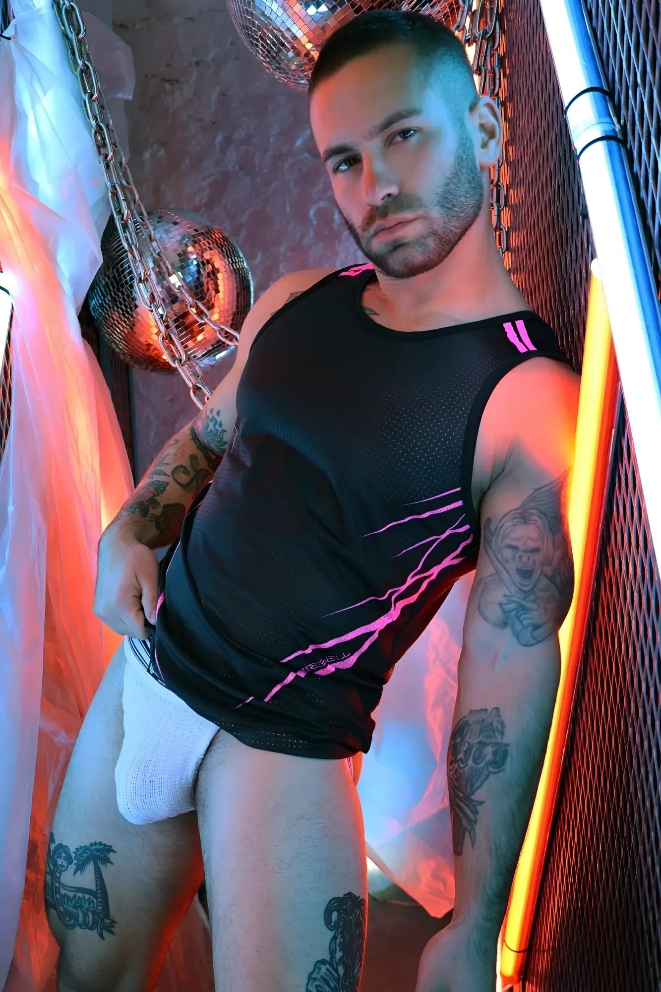Black mesh tank top revolution tank with pink lightning bolt accents for stylish activewear use