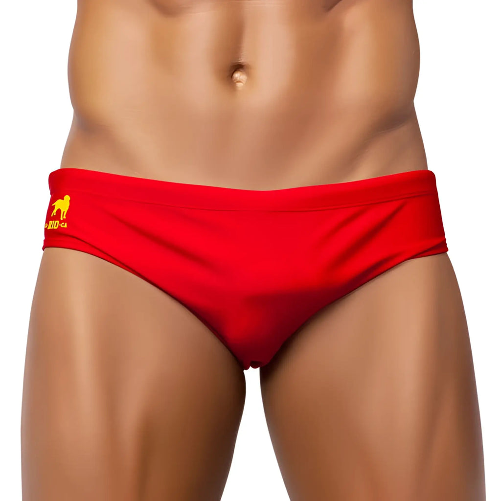 Red men’s brief cut solids sunga swim trunks with a yellow logo on the waistband for swimming and beachwear