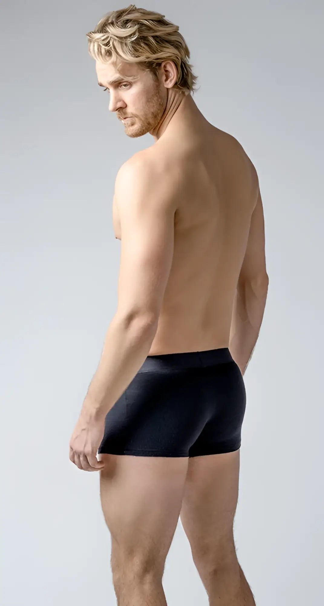 Black brief trunks with a smooth fitted design made from soft comfortable fabric for everyday wear