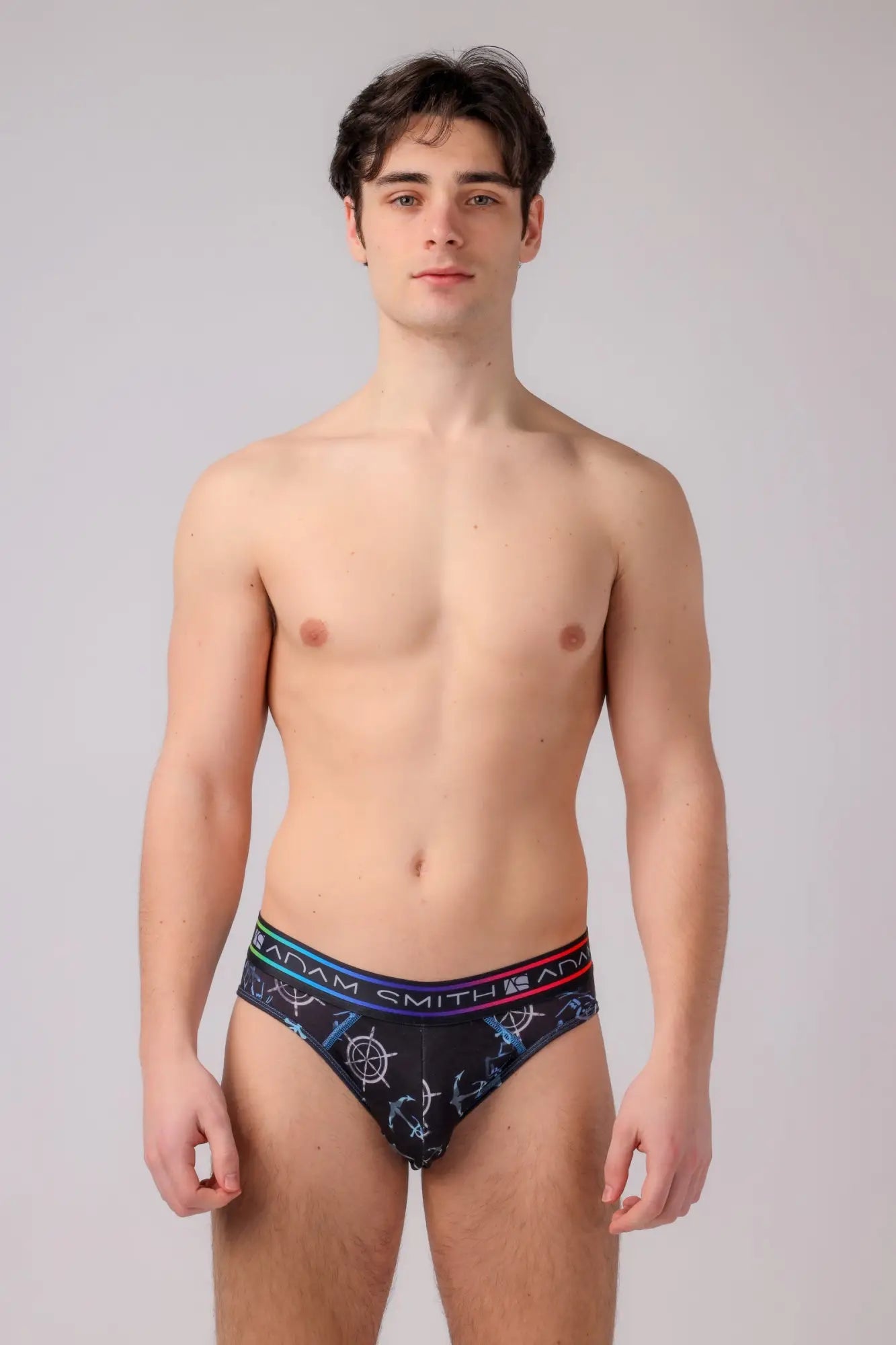 Black men’s briefs with a nautical anchor and ship wheel pattern in blue white and red accents