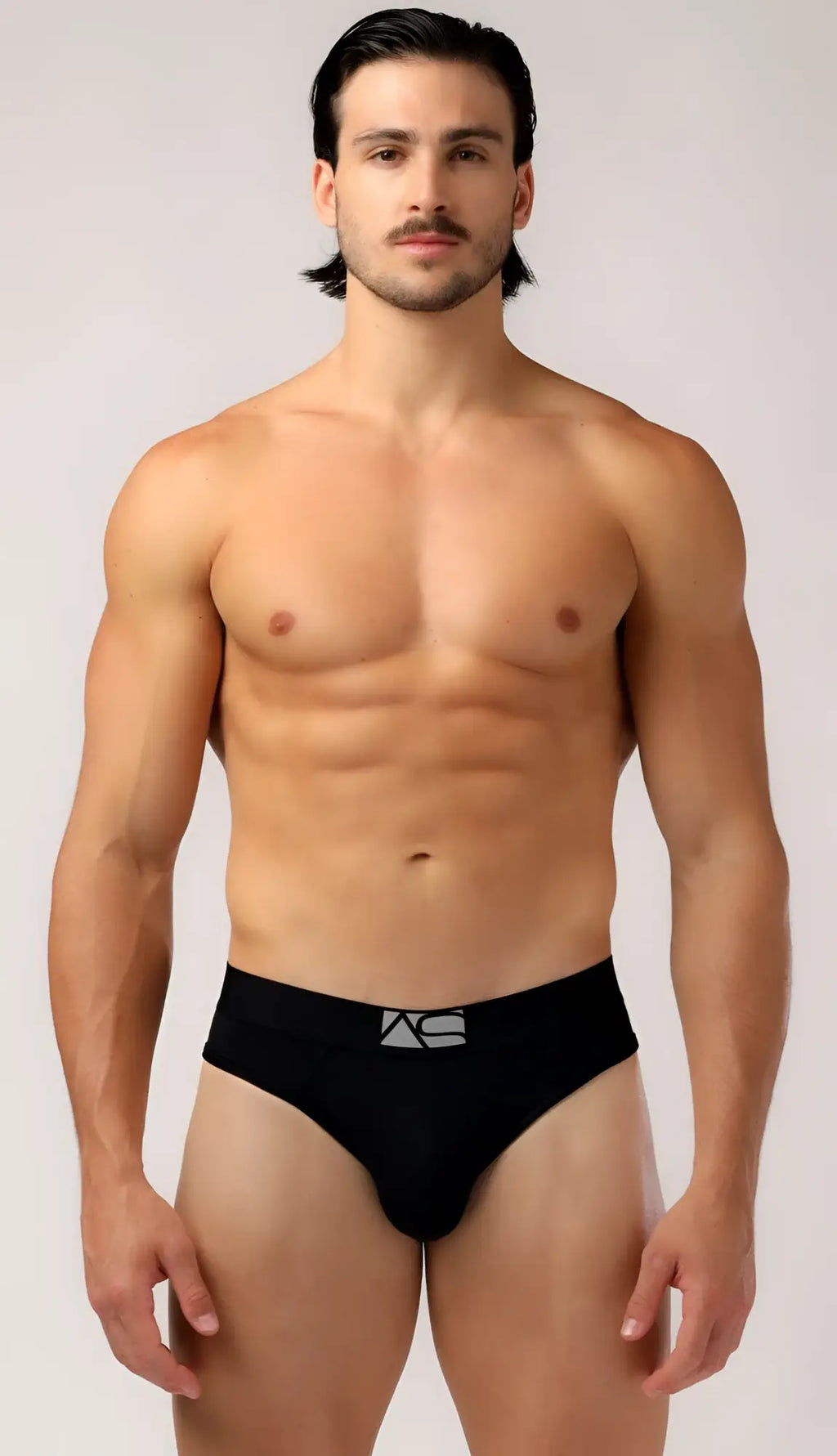 Black briefs featuring a silver logo on the waistband designed for comfortable everyday wear