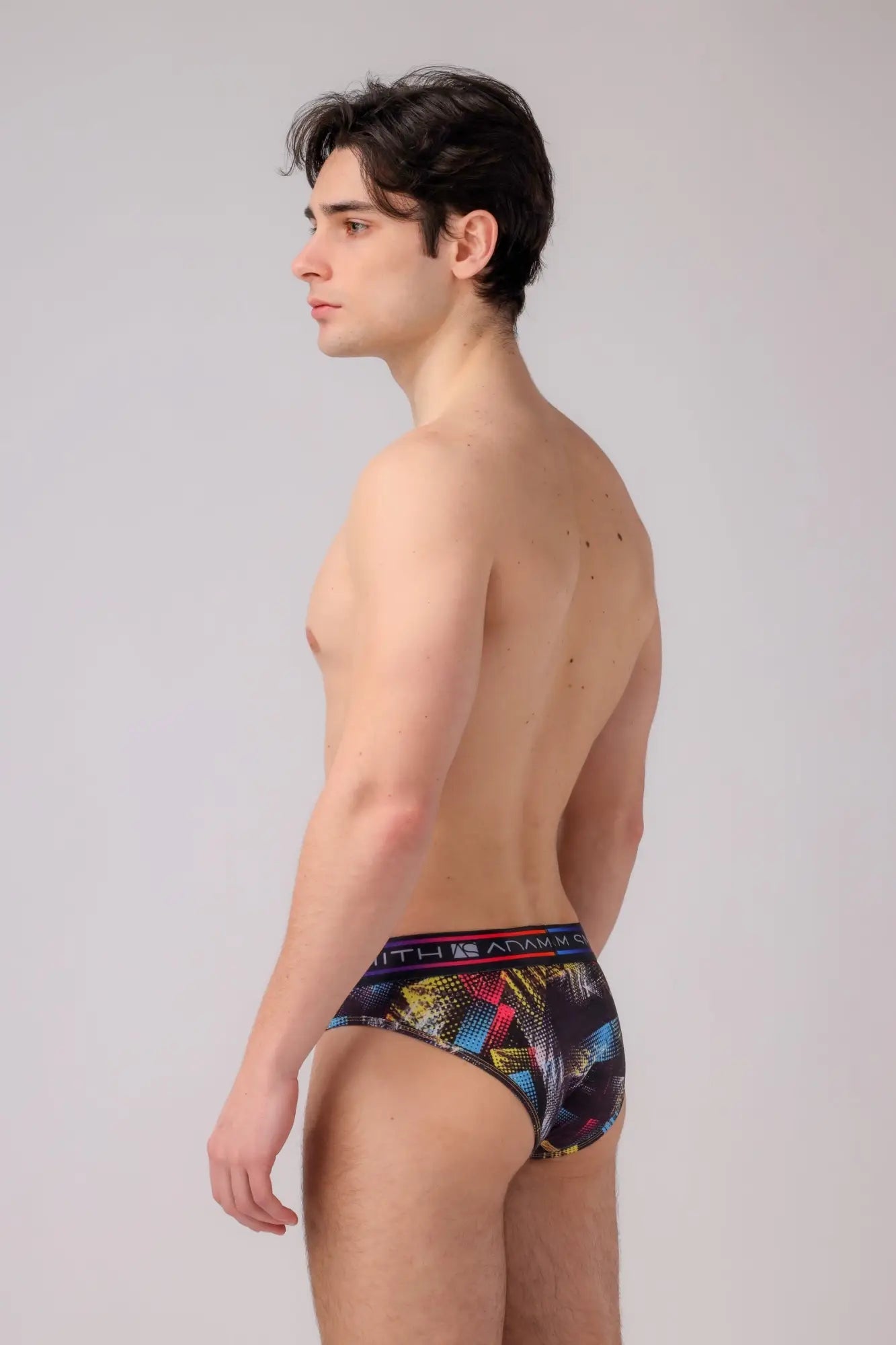 Multicolored geometric-patterned men’s briefs with a branded waistband made from soft breathable fabric
