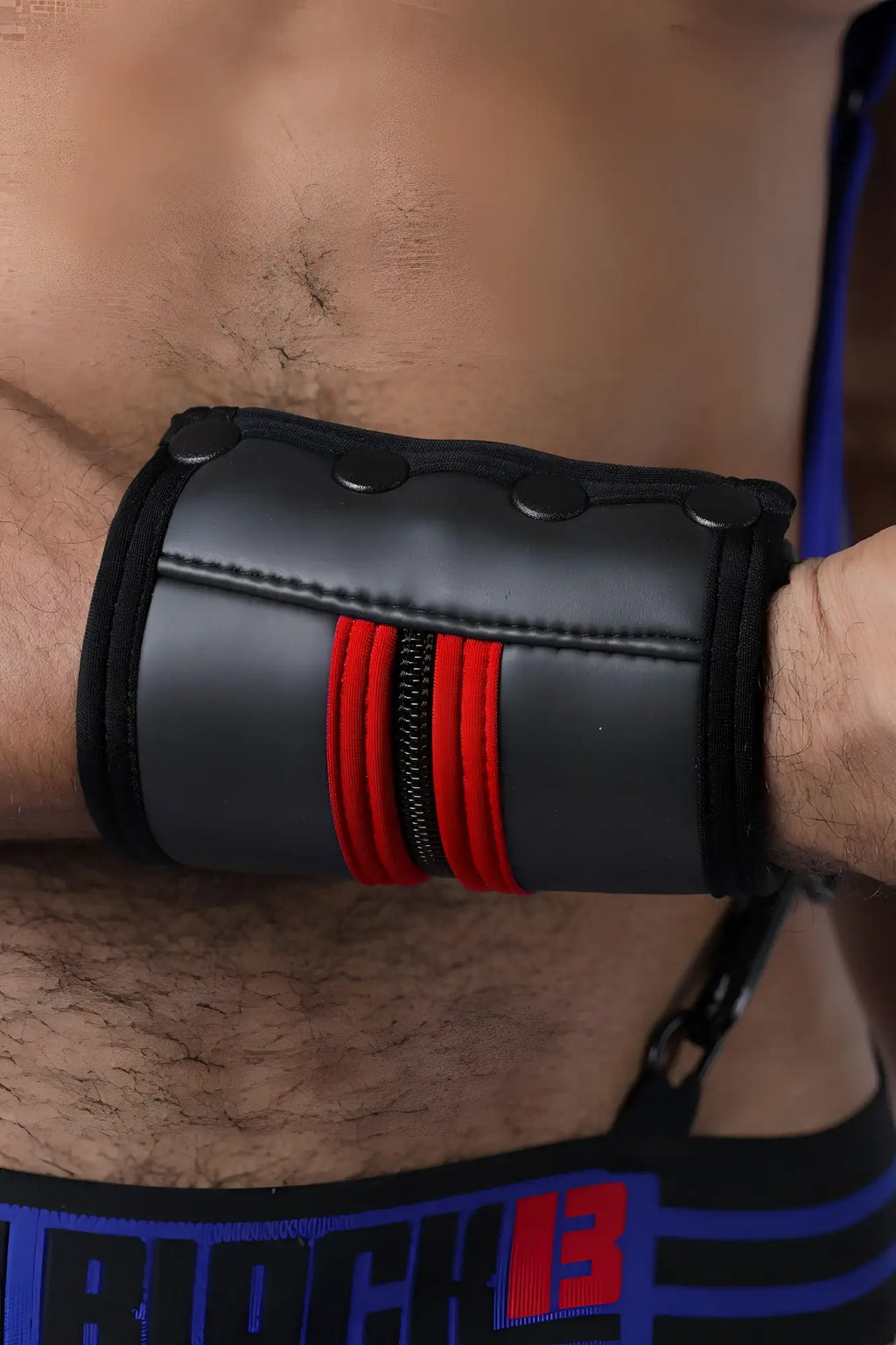 Buckle up cuff black leather wristband with red zipper accents and three black snap buttons available in five colors