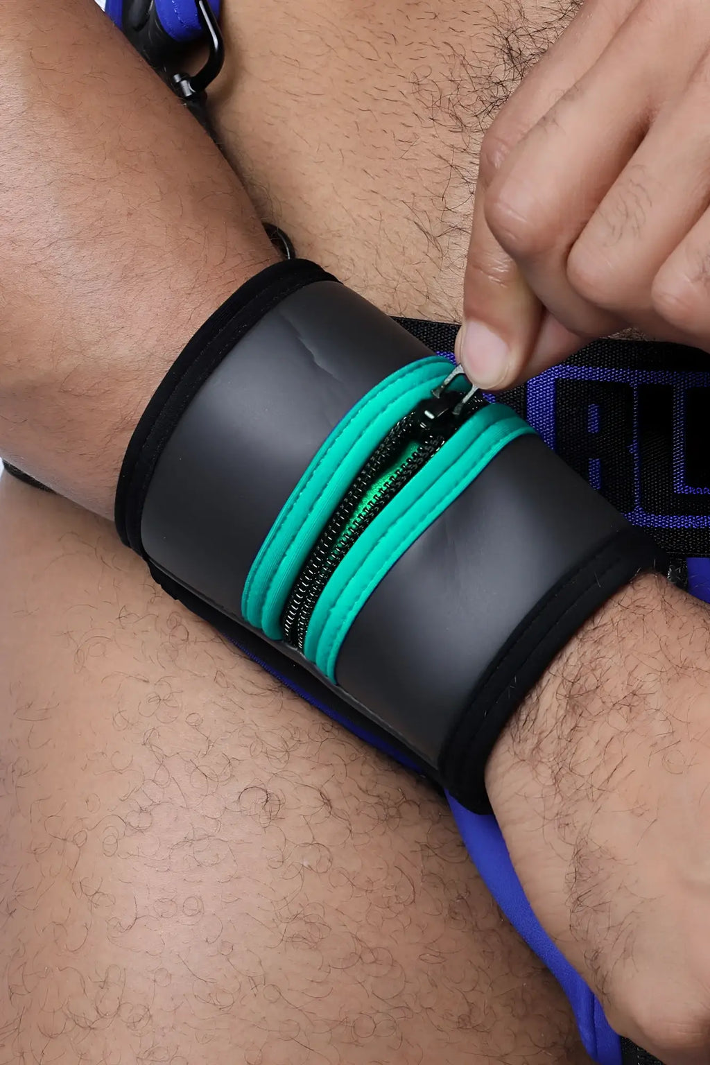 Black buckle up cuff wristband with teal zipper accents available in 5 colors for stylish secure wear