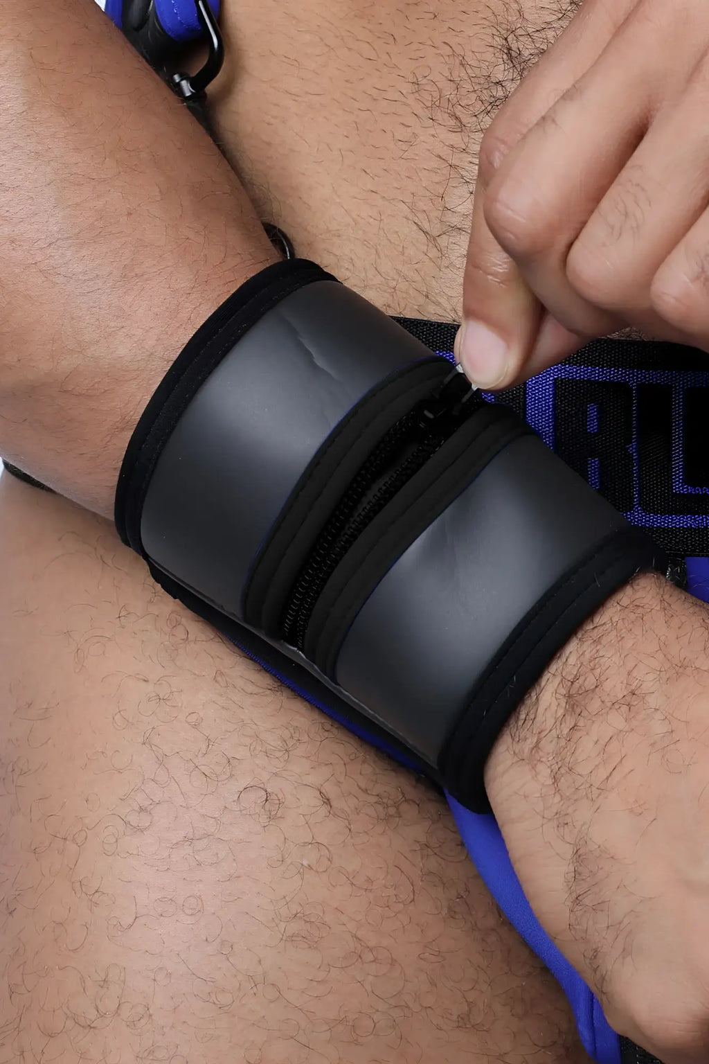 Black buckle up cuff wristband with zipper closure and blue trim available in 5 colors for everyday wear