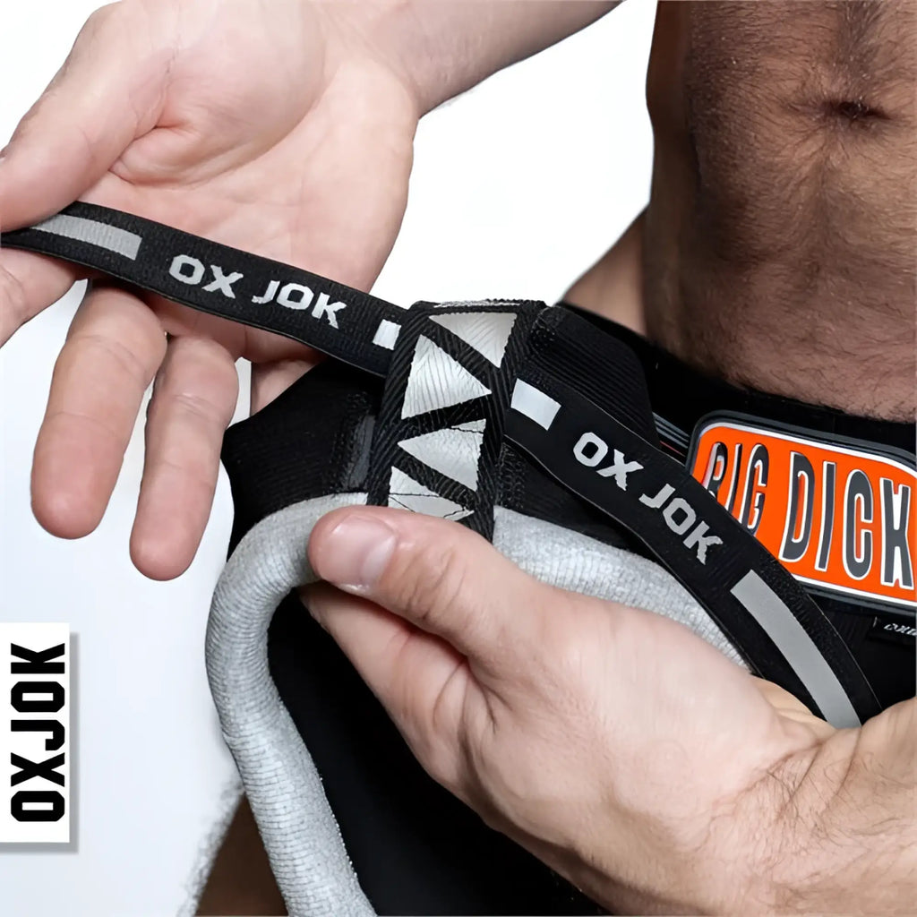 Black and gray bulger jockstrap with ox jok branded lacing and reflective stripes designed for support and visibility